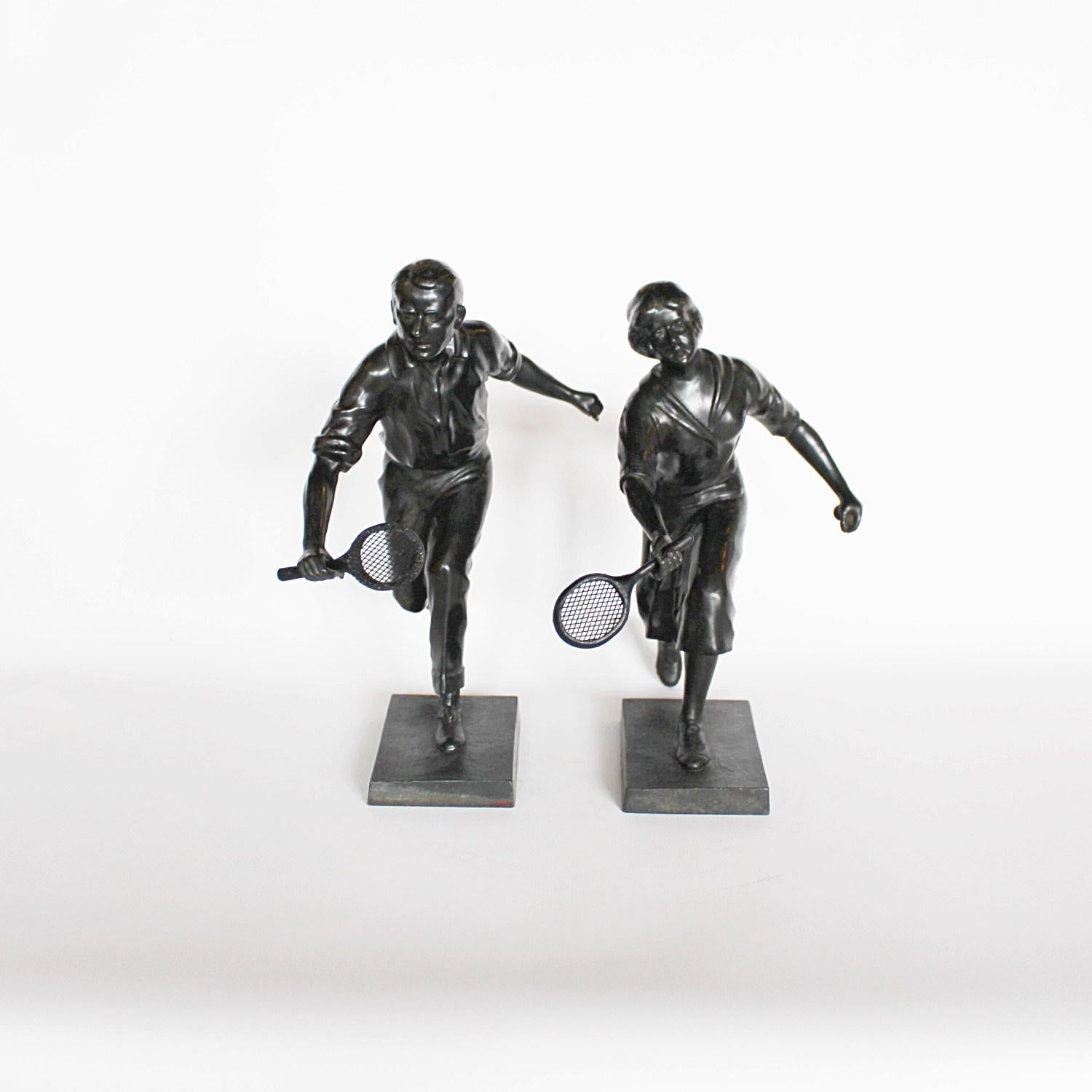 A pair of Art Deco spelter tennis players. Man and woman in mid swing, running for the oncoming ball. Unsigned.


 