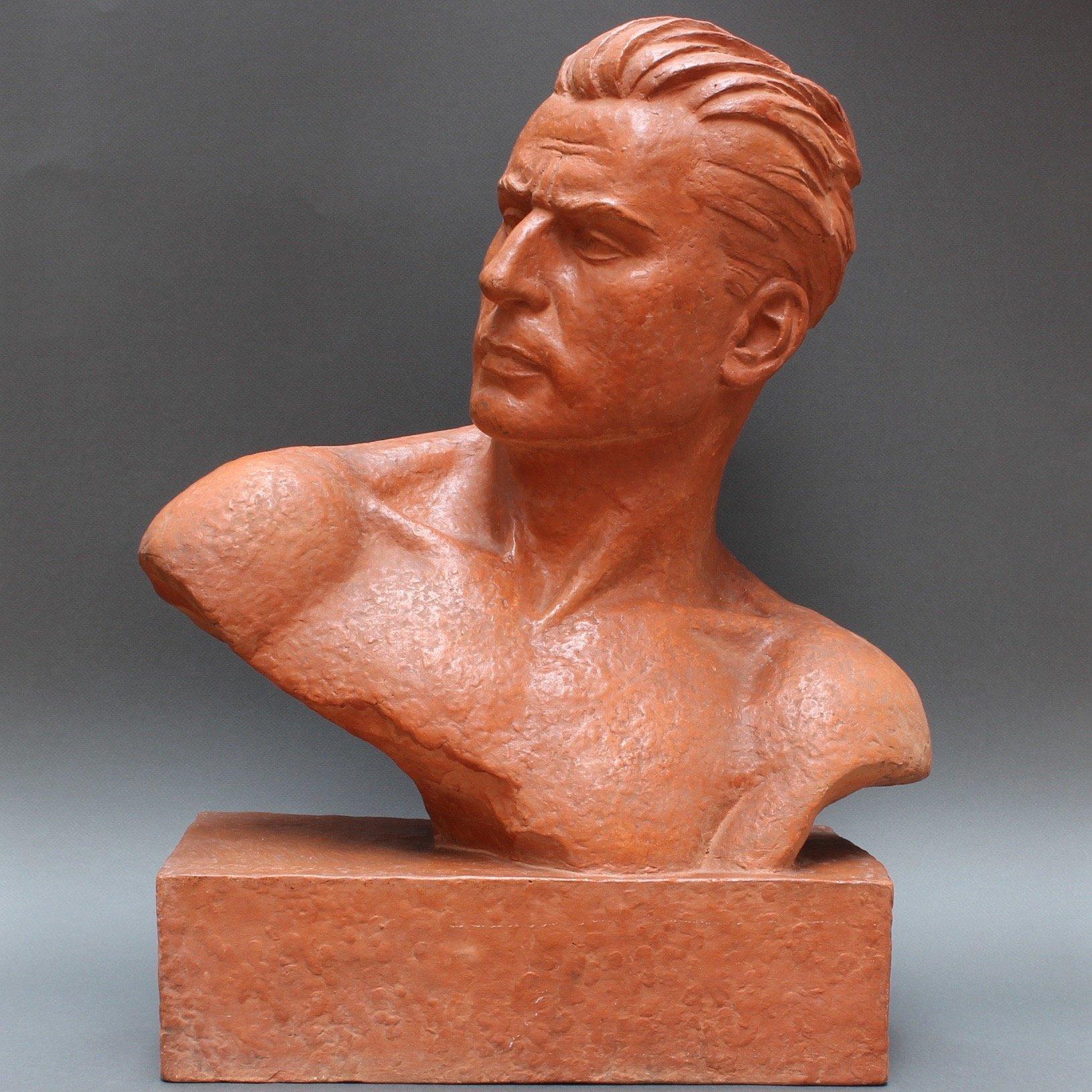 Art Deco terracotta sculpture bust of stylized man by Demétre H. Chiparus (circa 1930s). Art Deco was the expression of a desire to be modern. It featured rare and expensive materials and exquisite craftsmanship. Chiparus was inspired in his work by