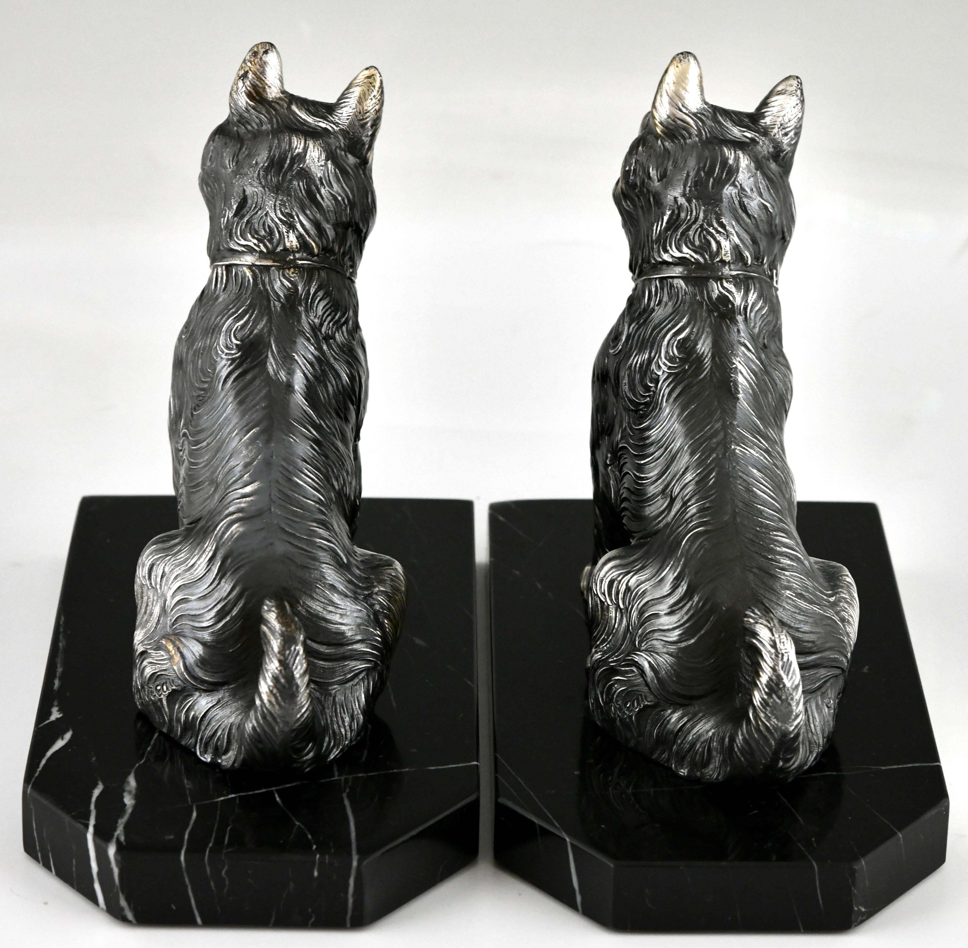 Patinated Art Deco terrier dog bookends by Hippolyte Moreau, France 1930.  For Sale