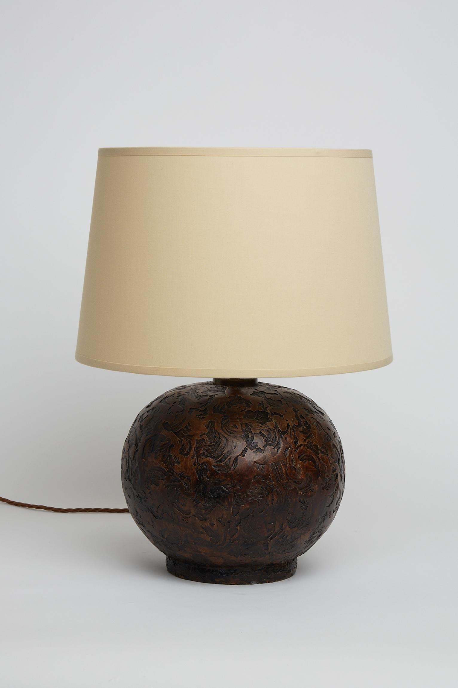 An Art Deco highly textured ceramic table lamp.
France, Circa 1940.
Measures: With the shade: 48 cm high by 31 cm diameter.
Lamp base only: 30 cm high by 25 cm diameter.
