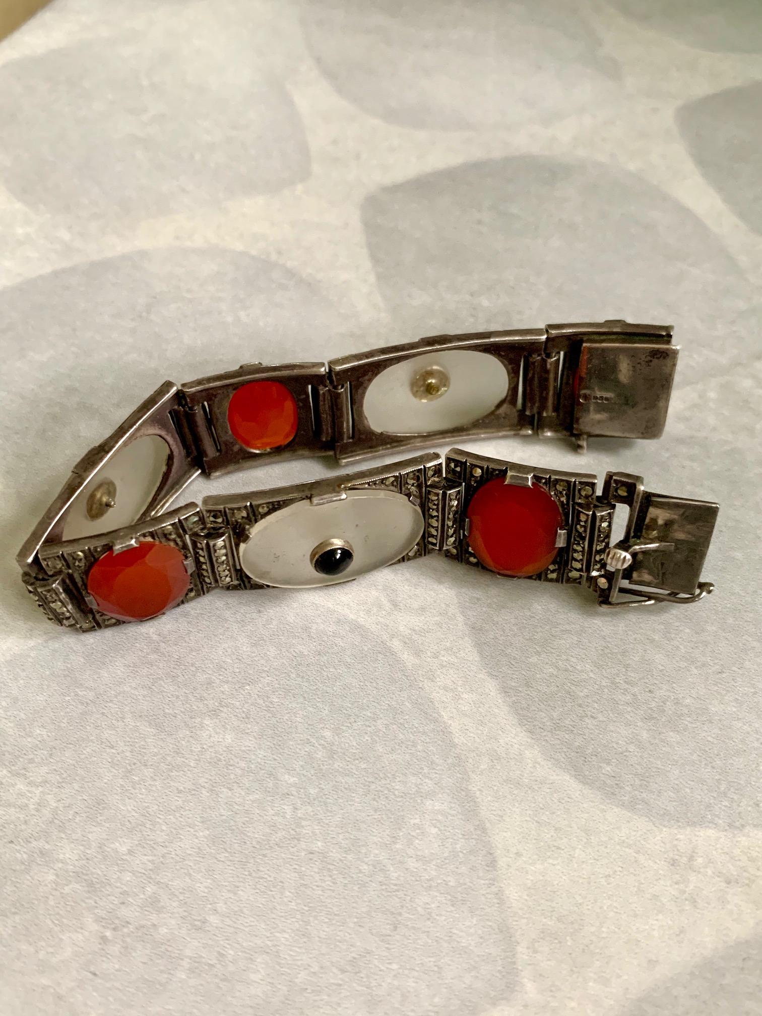 This Art Deco theodor Fahrner bracelet features Rock Crystal, Black Onyx, Carnelian and Marcasite.  It is stamped 