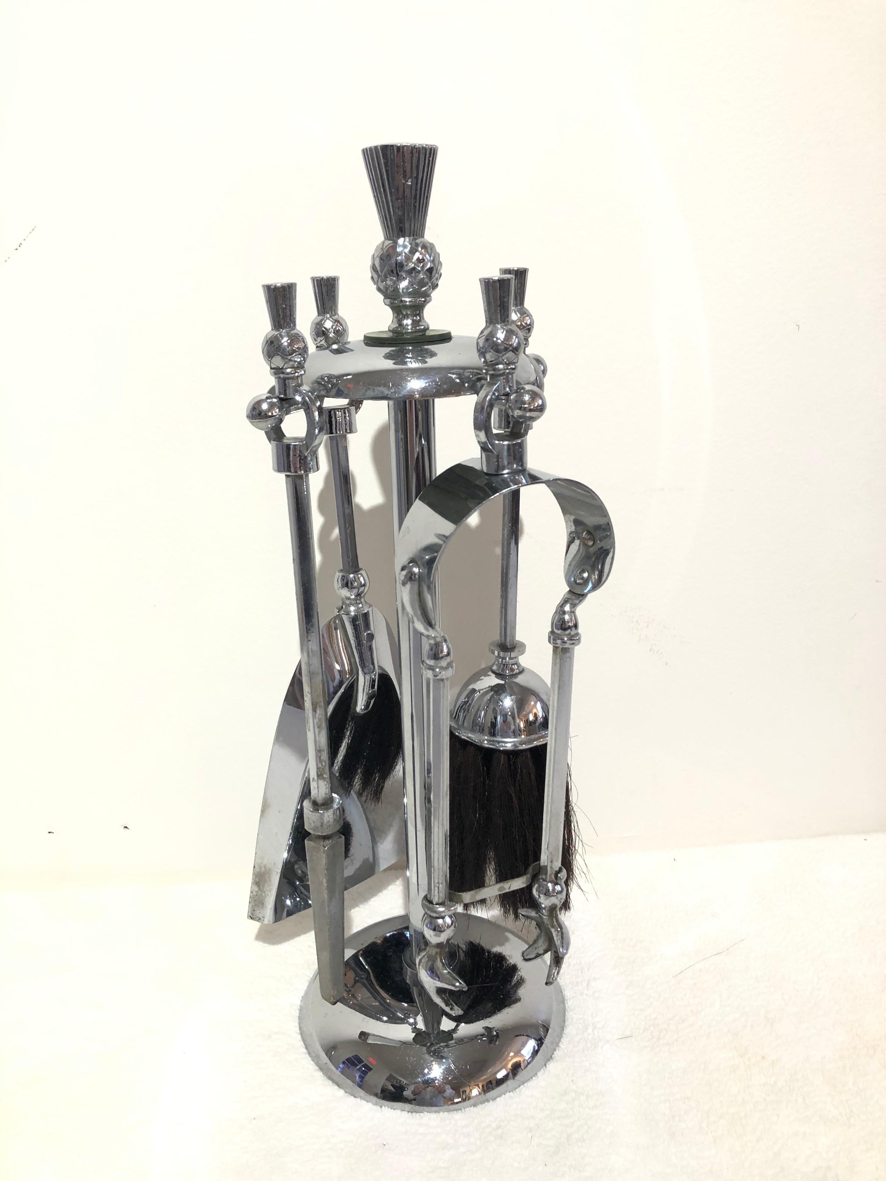 Art Deco petite chrome or Bakelite disk thistle design top fireplace tools all original finish, shovel, tongs, brush, and poker together with circular holder.