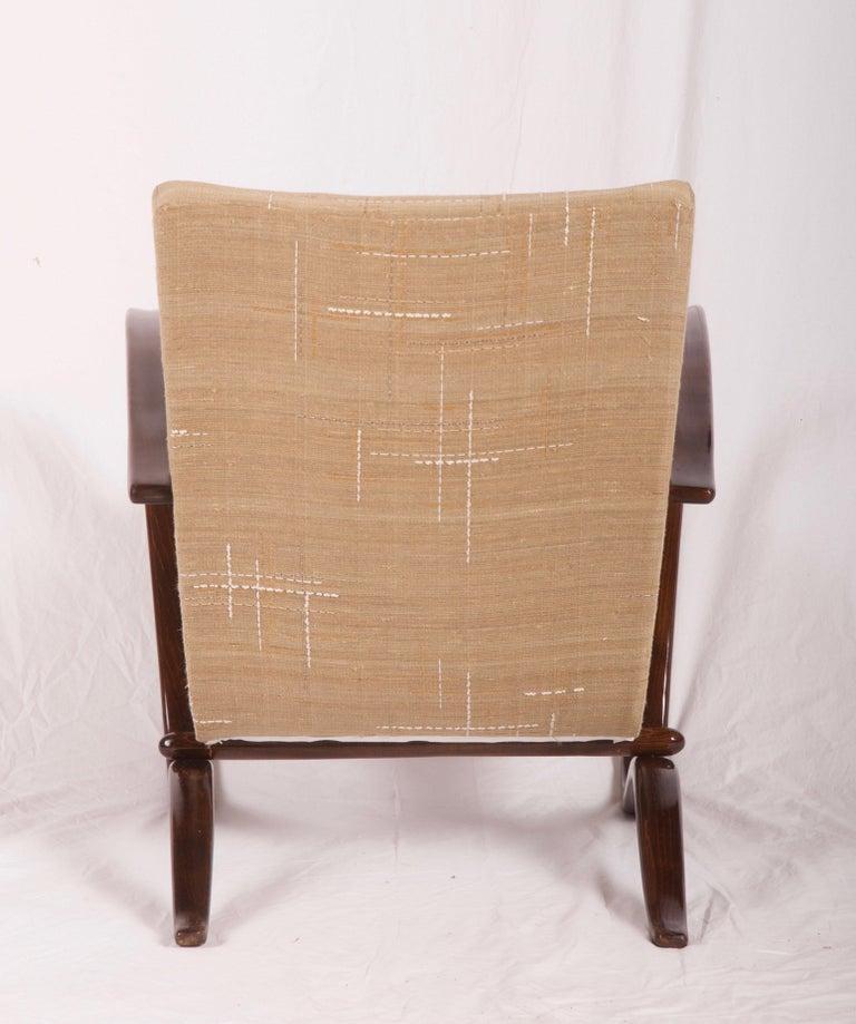 Beech bentwood walnut stained armchair made by Thonet in the 1930s.
Excellent restored with seat springs upholstered with Dedar silk fabric.
Another fabric and wood finish on request possible
On request several available
Delivery time about 5-6