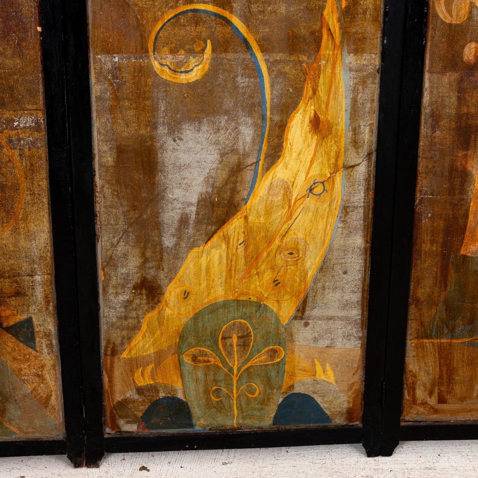 Art Deco style hinged three panel screen decorated on both sides with stylized abstract geometric floral designs. Please note of wear consistent with age including patina, paint loss, and finish loss.
