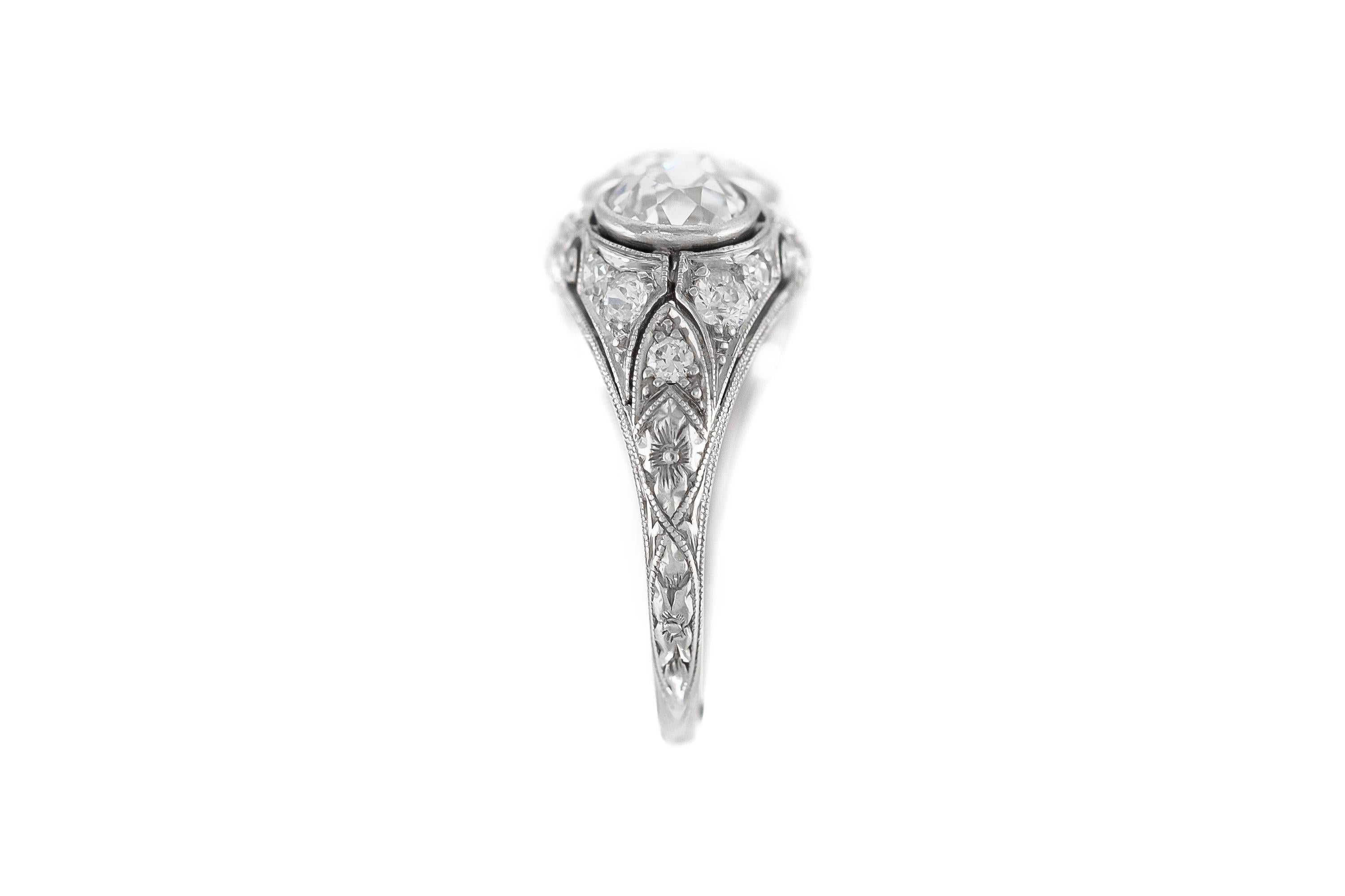 Finely crafted in a platinum setting with filigree.
The center diamond weighs approximately 1.70 carats and the two side diamonds weigh approximately a total of 1.60 carats.
The setting features diamonds.