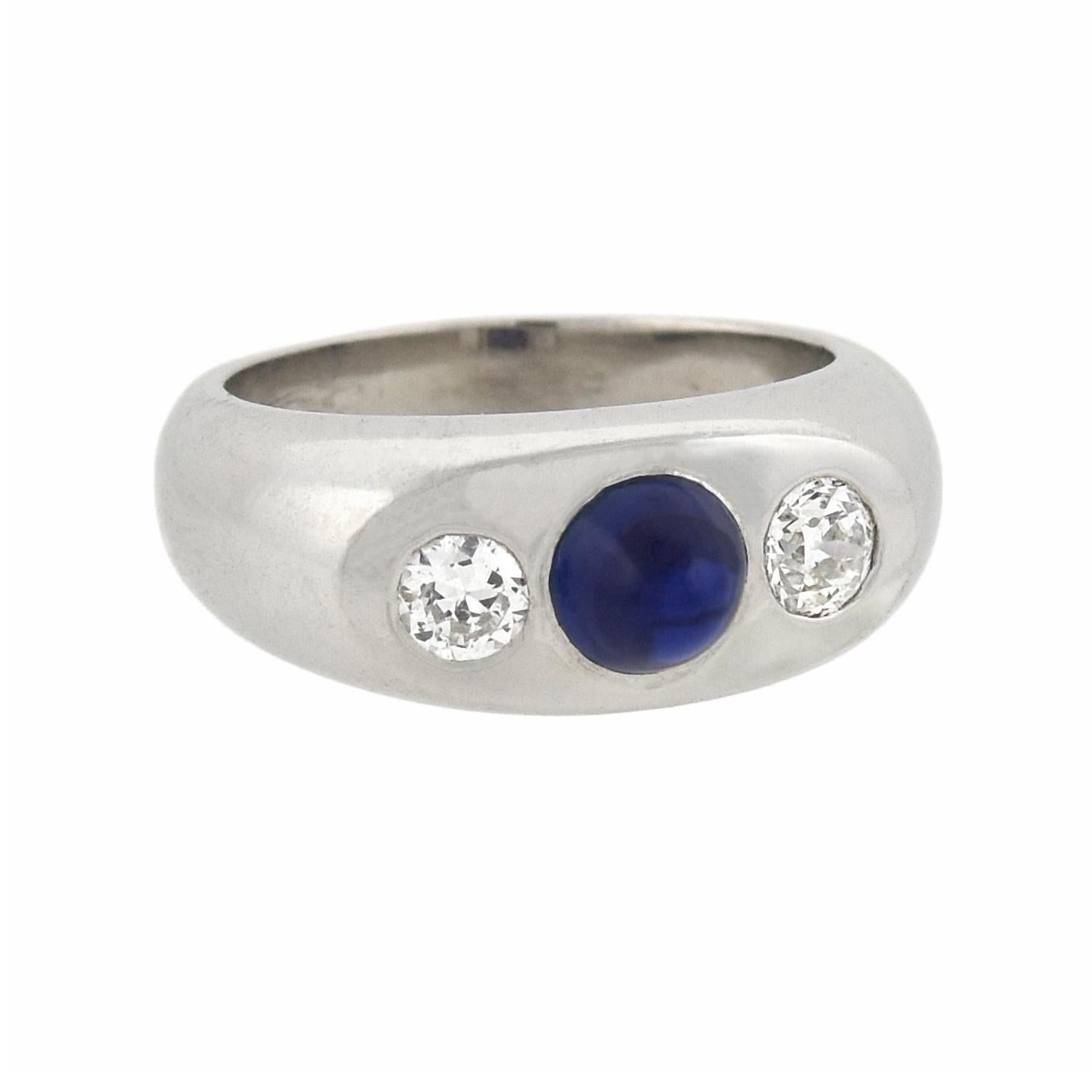 A absolutely stunning diamond and sapphire 3-stone ring from the Art Deco (ca1920s) era! Crafted in platinum, this fabulous piece features a bold 3-stone design comprised of two diamonds and a single sapphire. The sapphire, which is bezel set in the