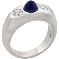 Bague Art déco à trois pierres, diamant et saphir cabochon bullet