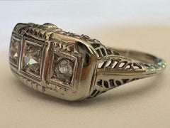 Art Deco Three-Stone Diamond and Filigree Ring