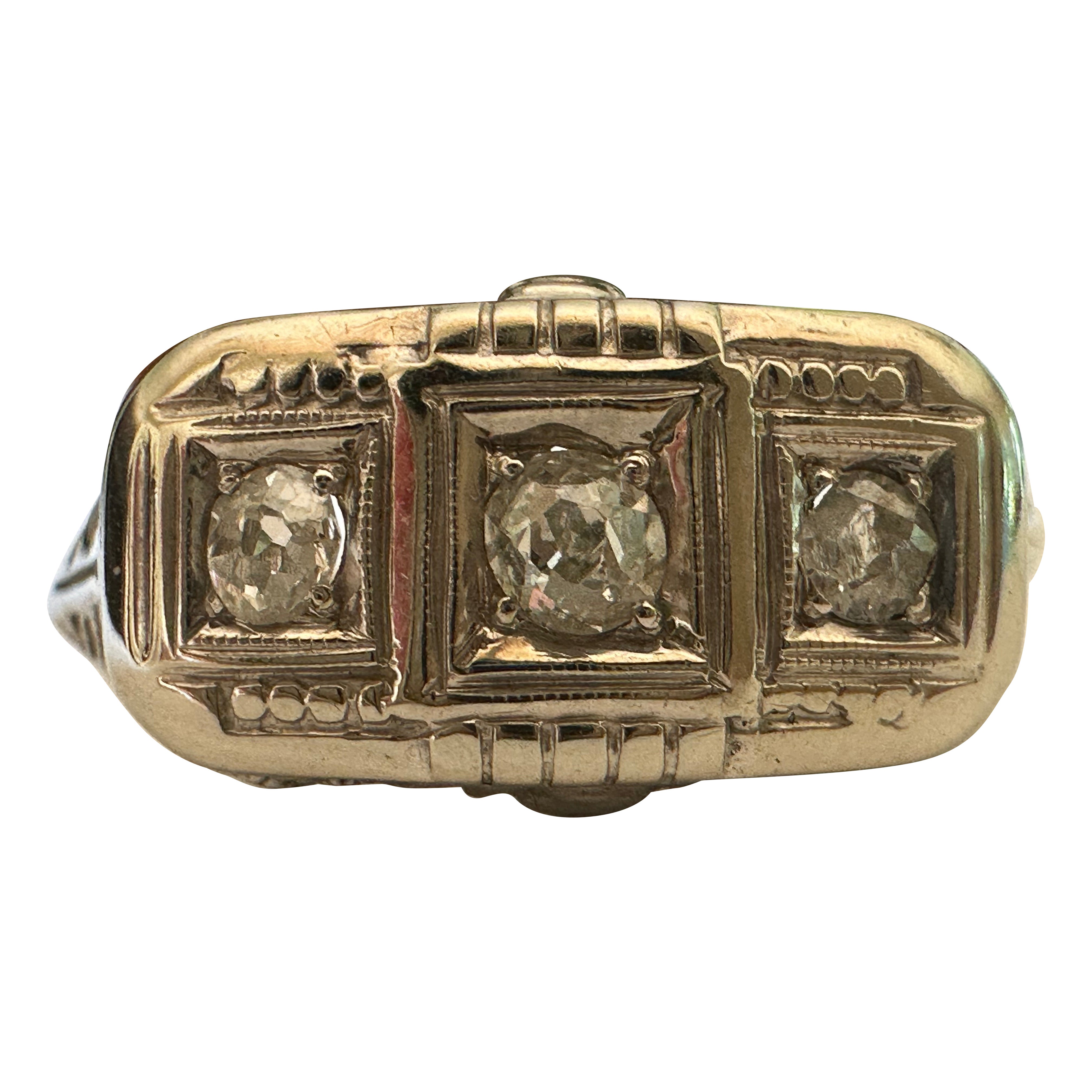 Bague Art déco à trois pierres, diamants et filigrane