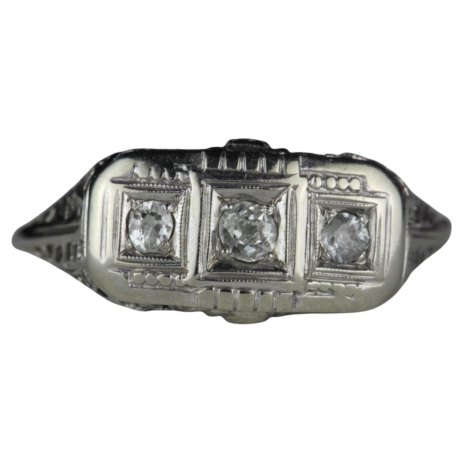 Art Deco Three-Stone Diamond and Filigree Ring For Sale