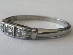 Fascia di diamanti a tre pietre in stile Art Deco