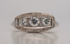 Art Deco Three-Stone Diamond Engagement Ring in 18 Karat Gold, circa 1920s
