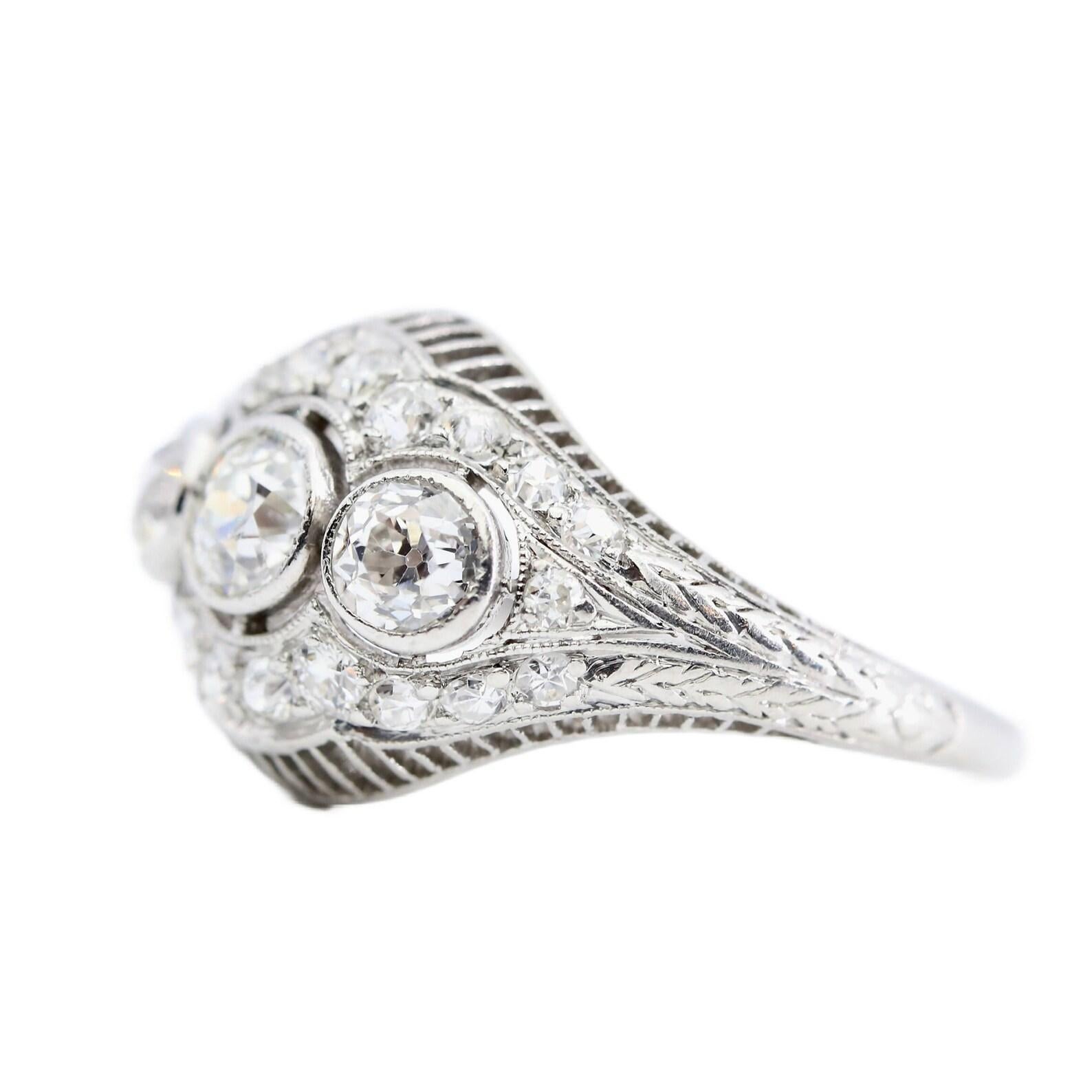 Old European Cut Art Deco Three Stone Diamond Filigree Ring in Platinum For Sale
