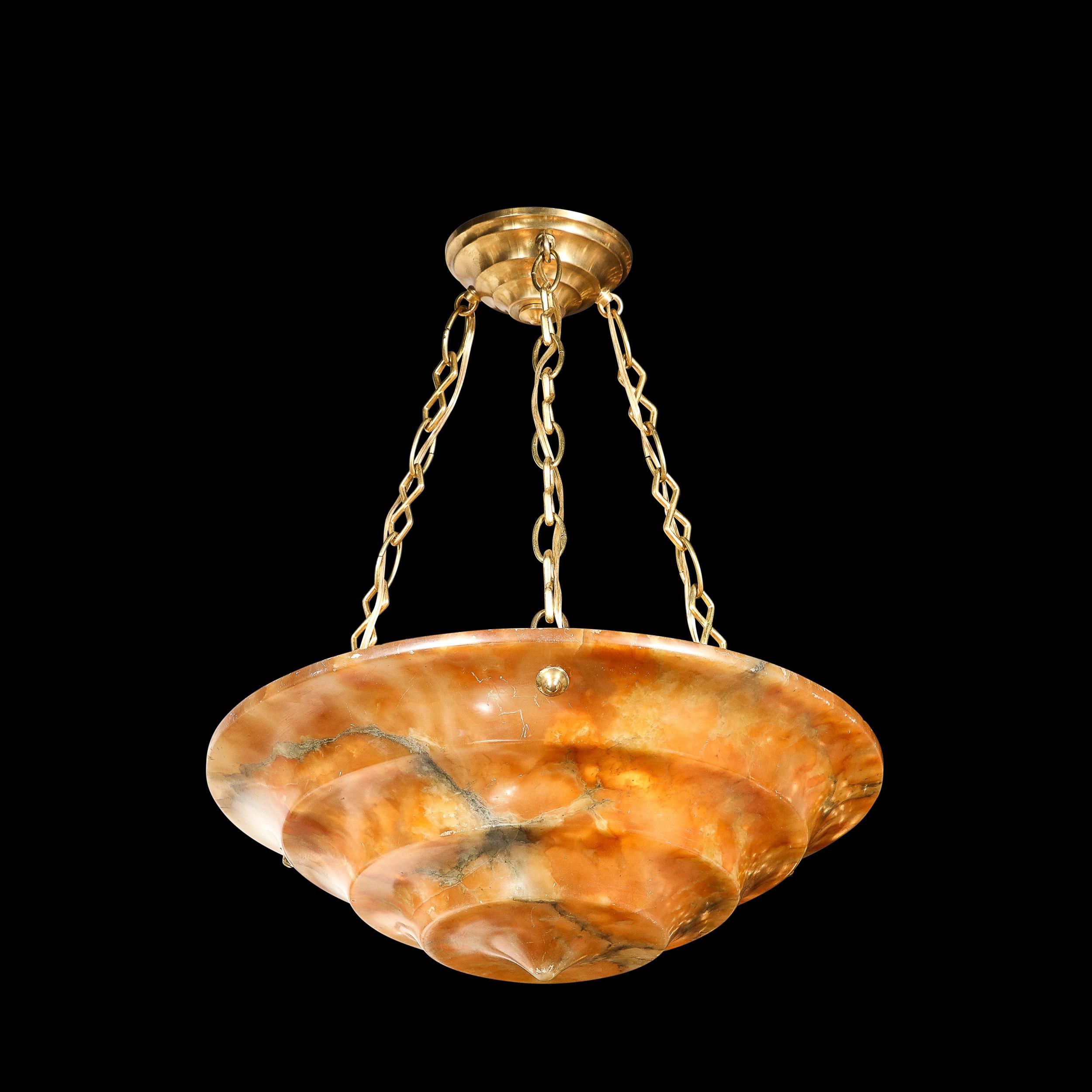 This classic and refined Art Deco Pendant Chandelier is rendered in Tiered Variegated Alabaster with Brass Fittings, originating from Italy, Circa 1930. Featuring stunning hues of warm earth toned oranges and umbers in a truly stunning variegated