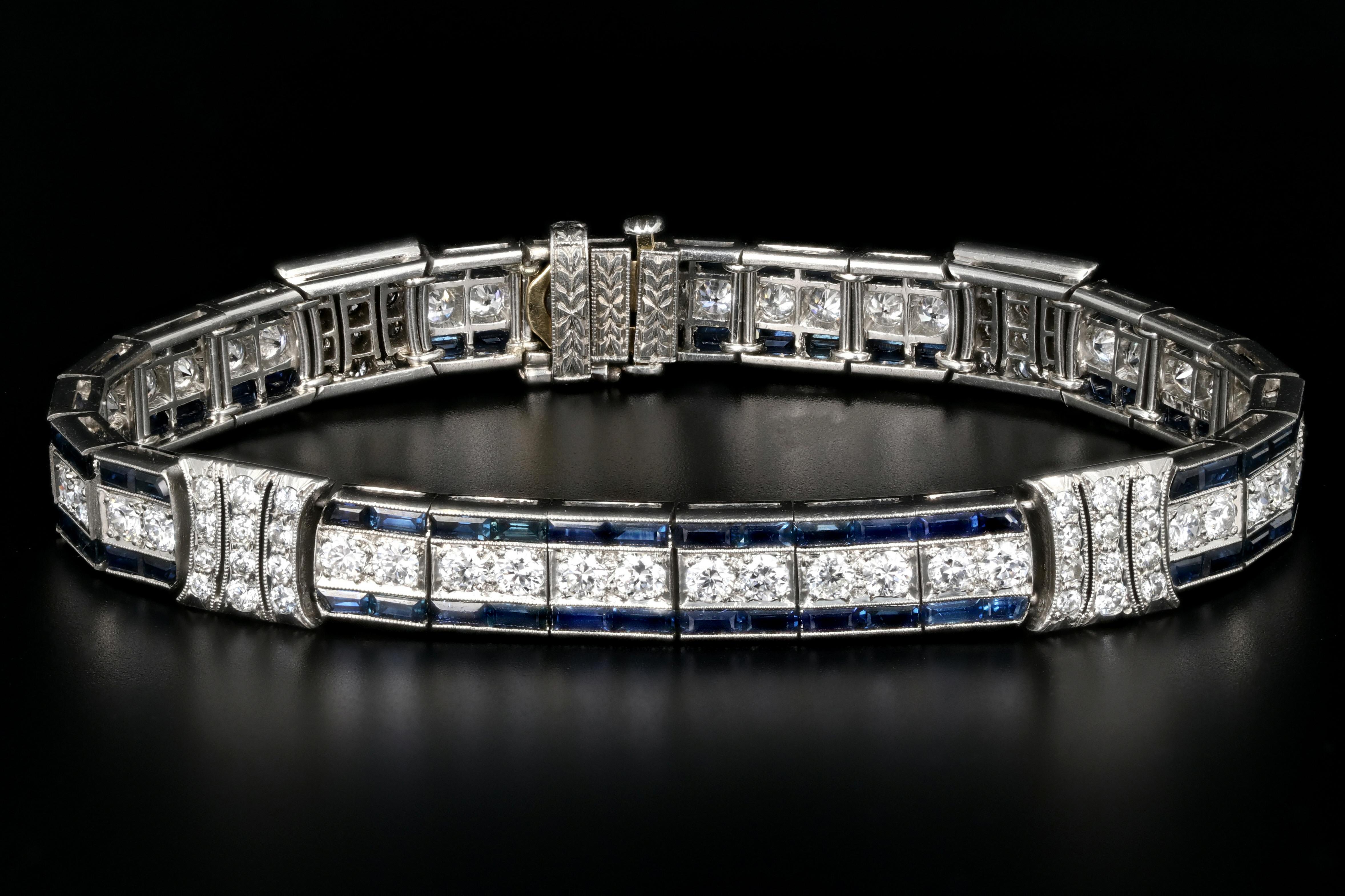 Era: Art Deco c.1925

Designer: Tiffany & Co.

Hallmarks: Tiffany & Co.

Composition: Platinum

Primary Stone: Old European Cut Diamonds

Stone Carat Weight: Approximately 5.5 Carats

Color/ Clarity: F/G VS1/2

Accent Stone: Baguette Cut Natural