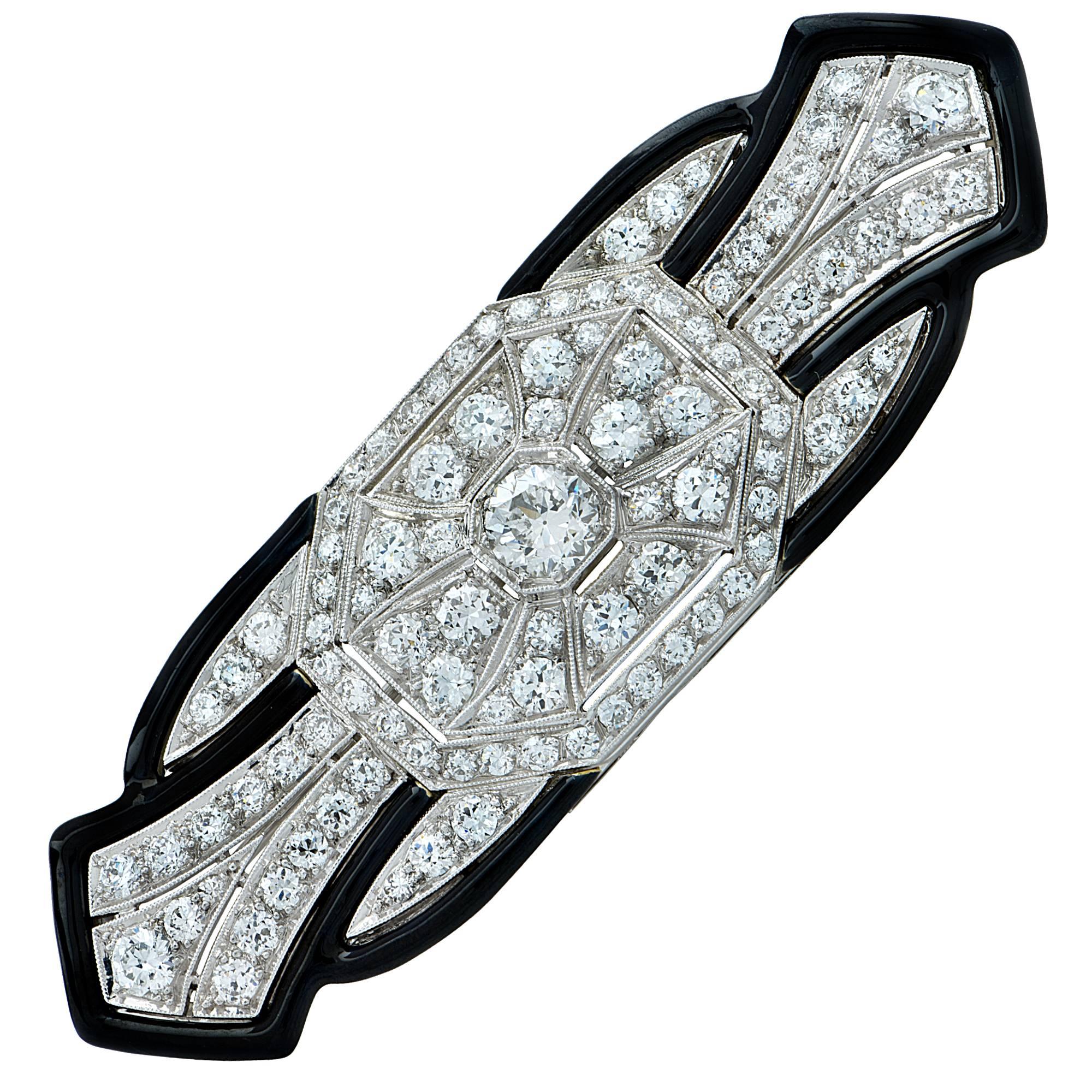 Rare Platinum Tiffany and Co. Art Deco brooch pin crafted in platinum, featuring approximately 4cts total weight of Old European cut diamonds F color VS clarity accented by enamel and fine millegraine.  The geometric and symmetrical lines of this