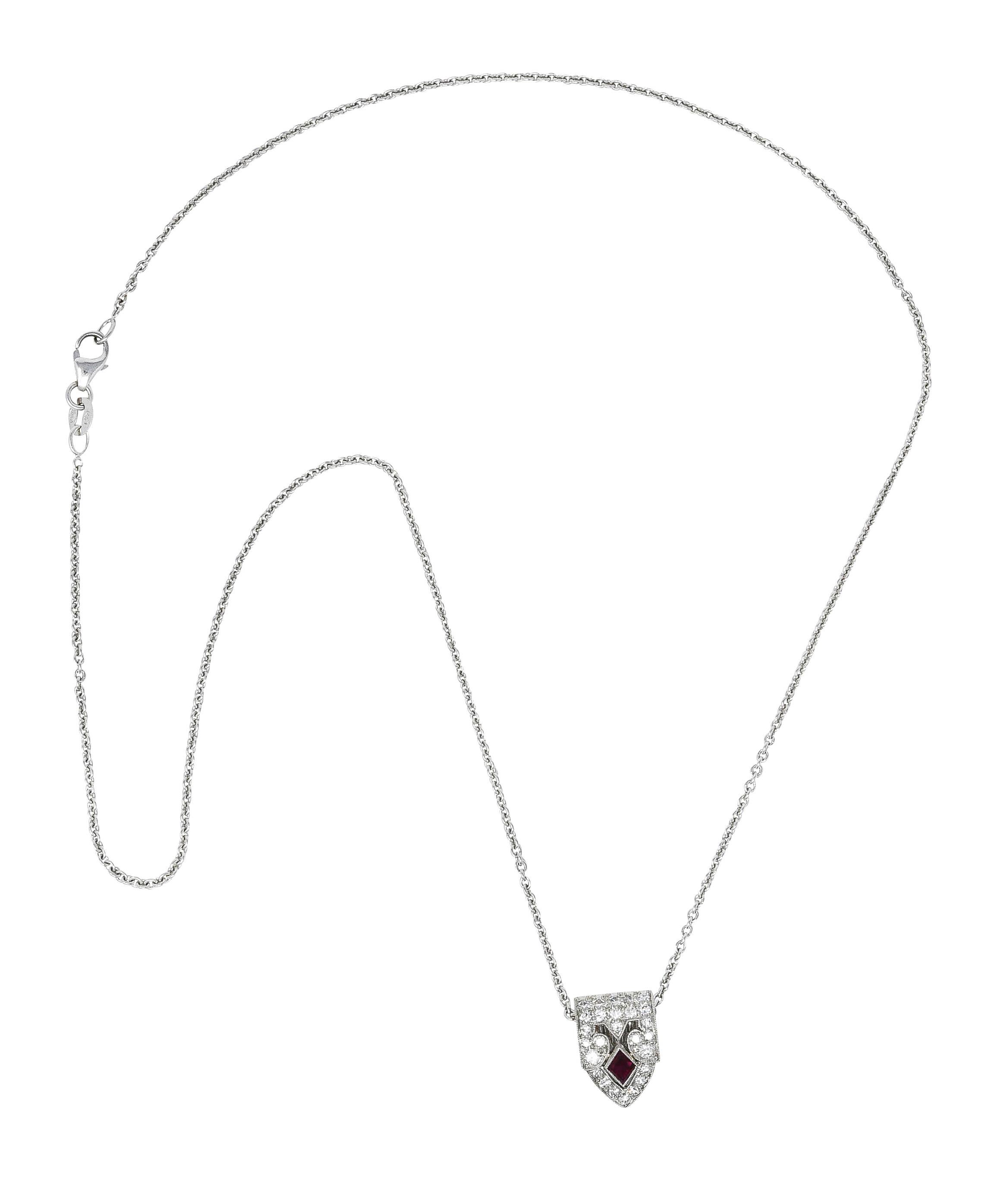 Cable chain necklace features a dynamically domed and pointed enhancer pendant clip

Opens on a hinge while featuring milgrain and a navette cut ruby

Weighing approximately 0.20 carat - slightly purple and strongly red in color

Surrounded by round