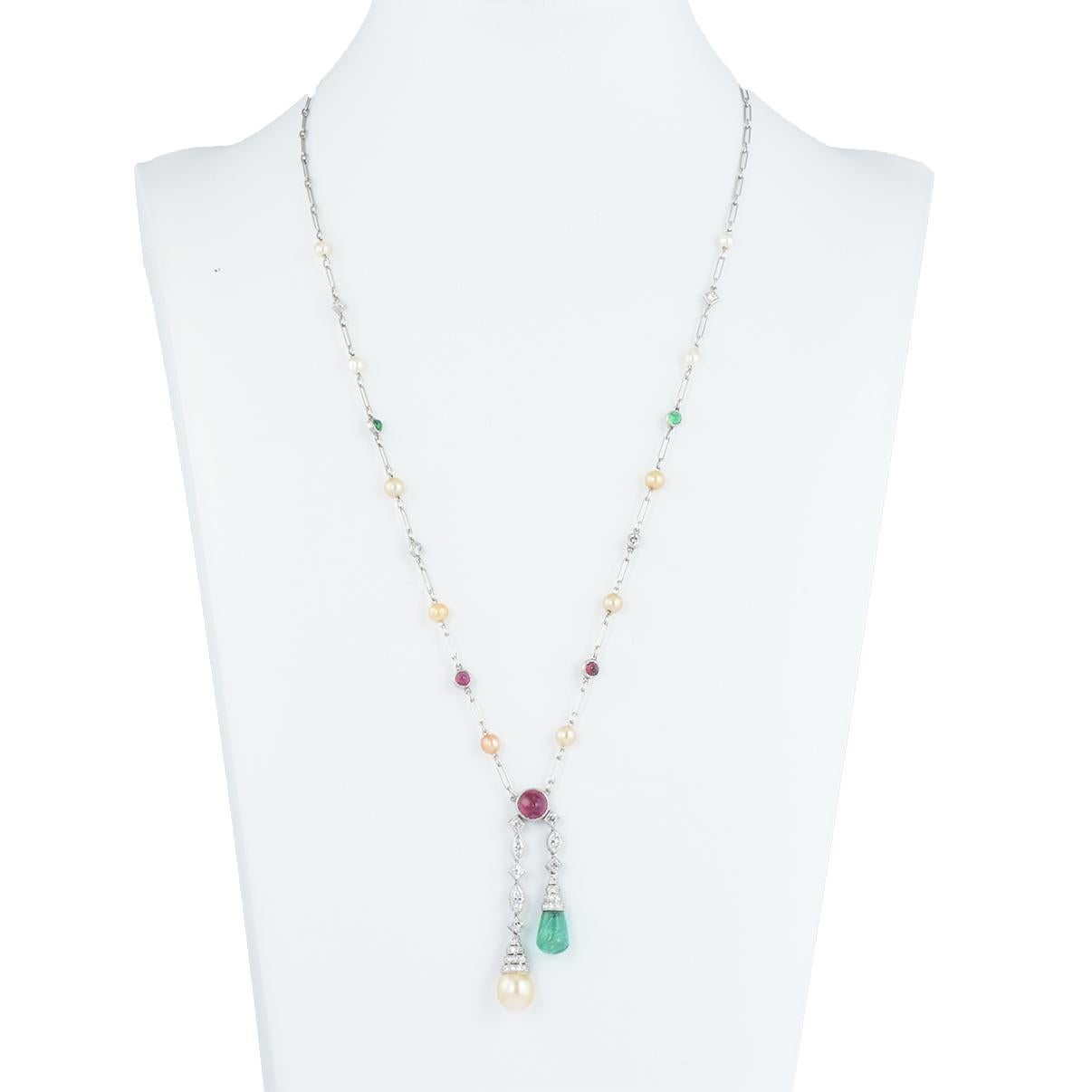 Stunning Art Deco platinum, diamond, pearl and gem set negligee necklace by Tiffany & Co. 

The central cabochon ruby suspends two articulated diamond drops set with a natural 7.8mm pearl and a carved emerald surmounted with diamonds in a tiered