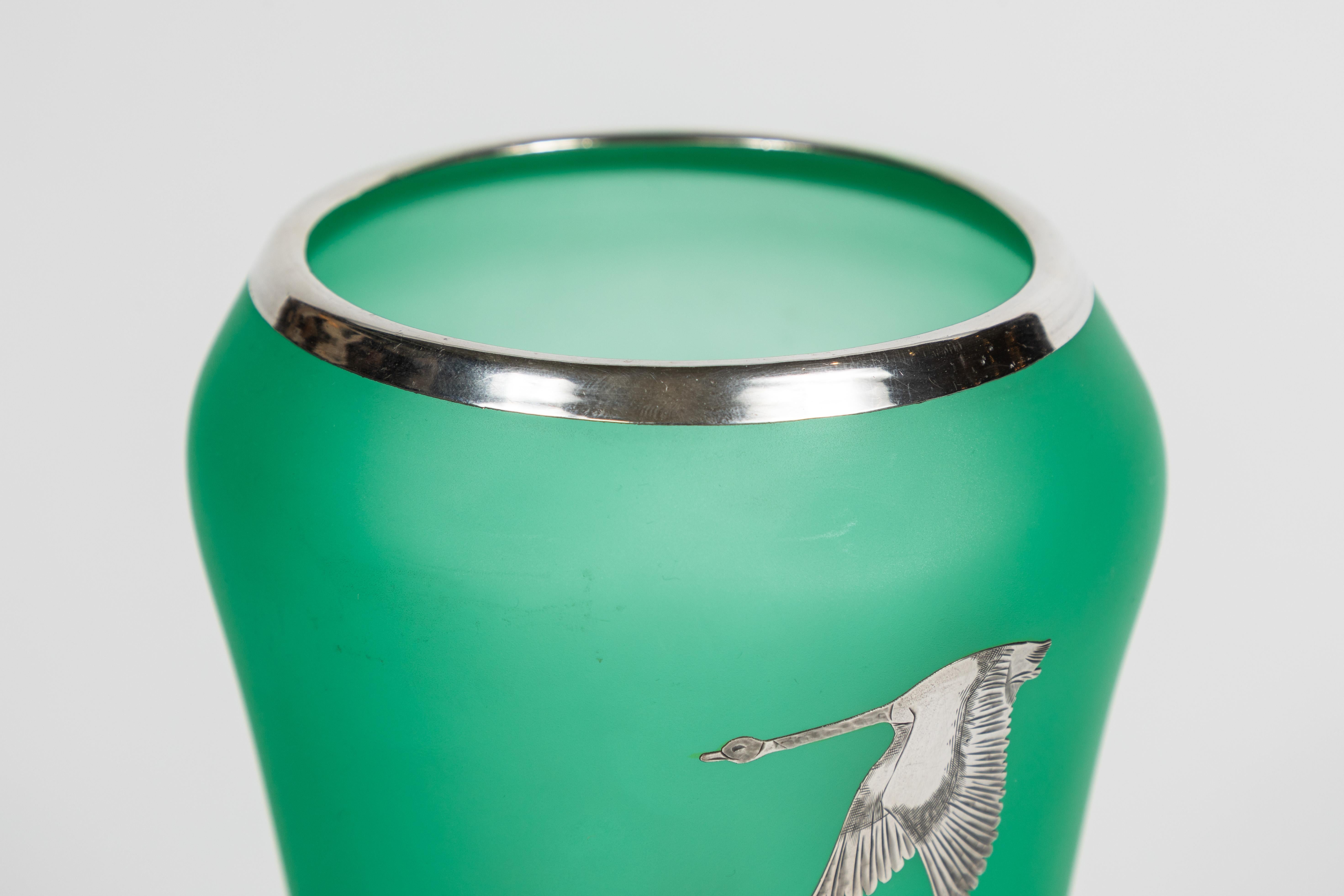 Art Deco Tiffin green satin glass vase with Canada geese and pine trees motif, Rockwell silver overlay, circa 1930s

Newly polished.