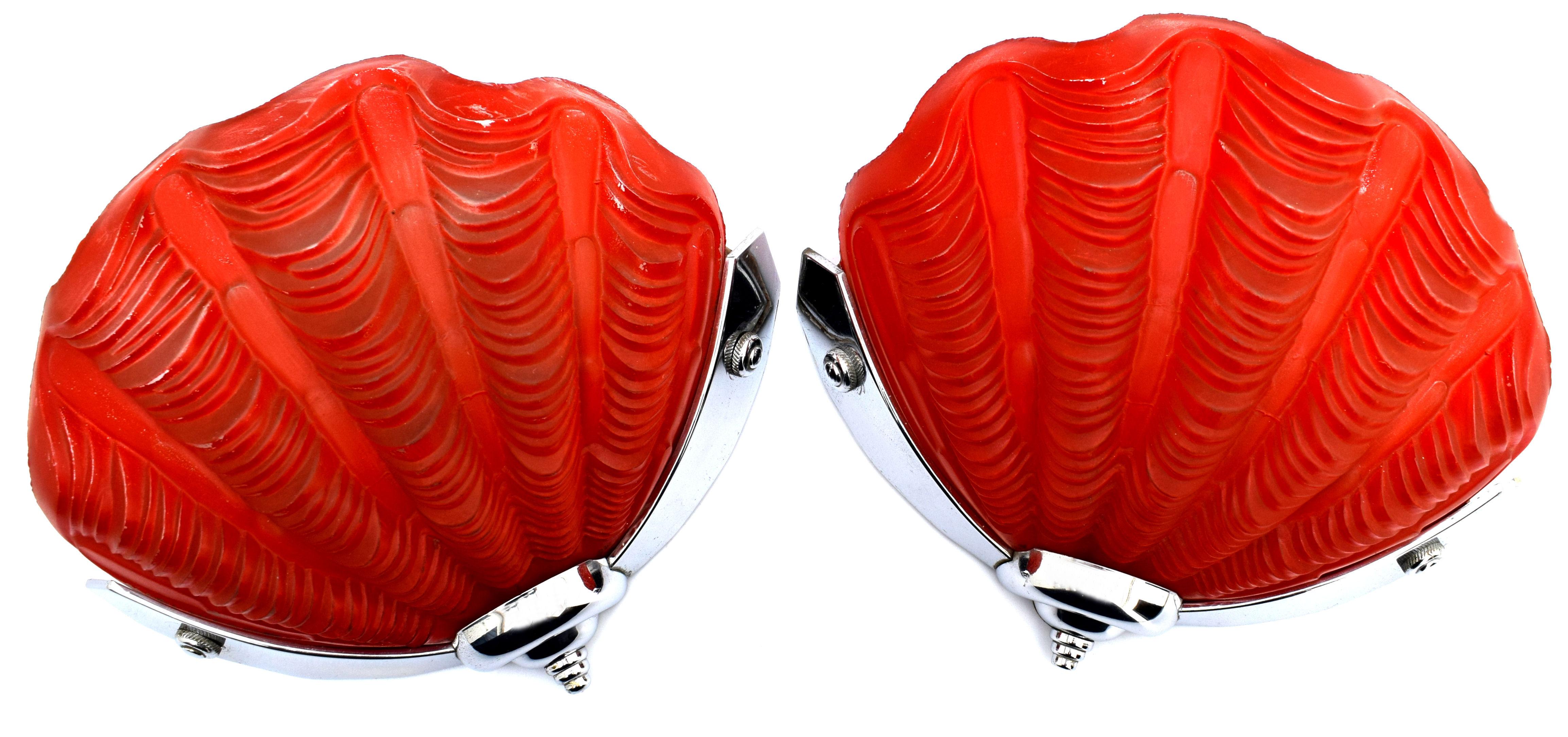 A beautiful matching set of Art Deco wall light sconces in the shape of shells in a rare and unusual colour of tomato red. The color of the glass doesn't actually change the colour of the light omitted you would need to have a red bulb for that but