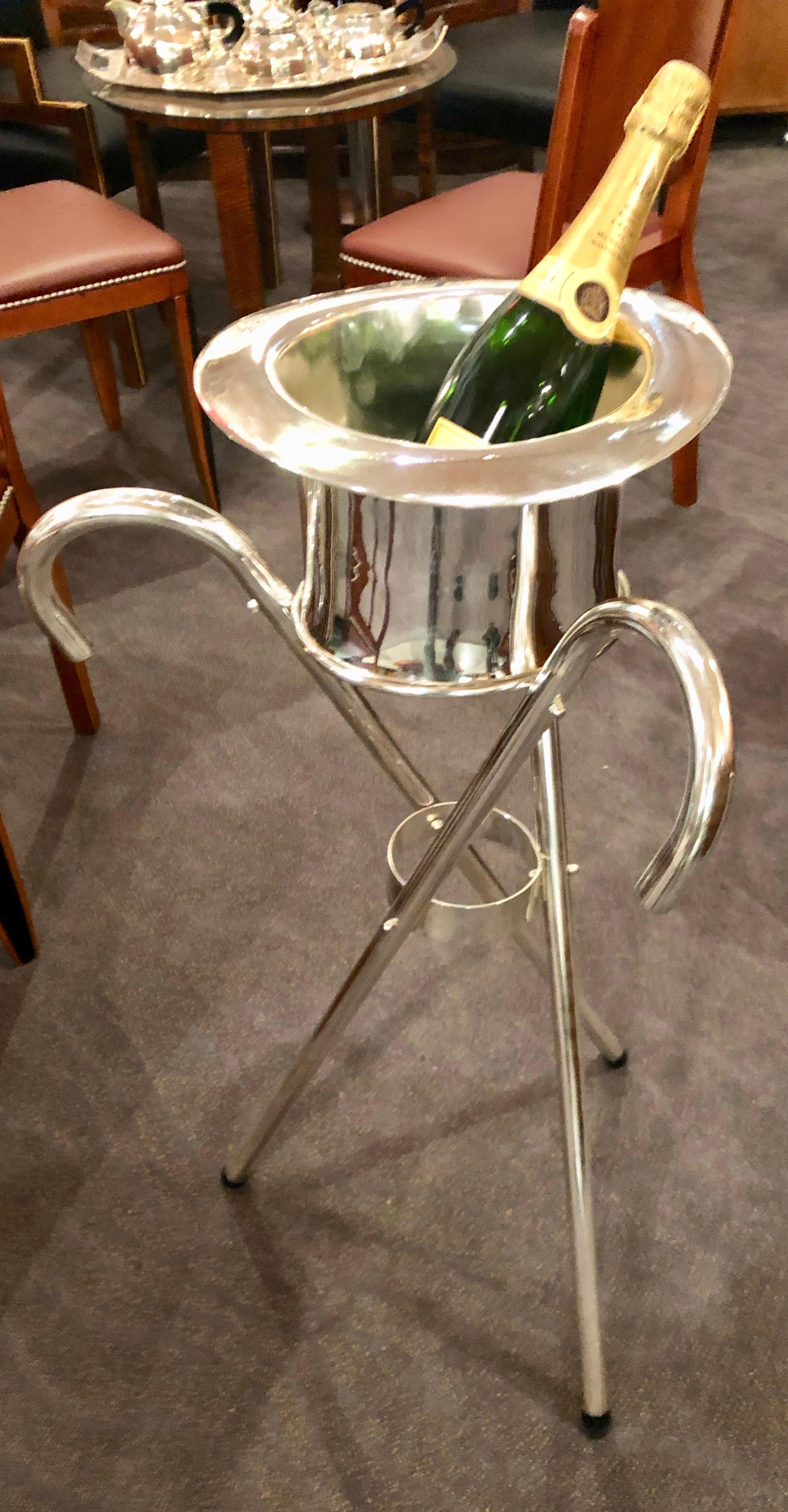 Art Deco Champagne bucket in the shape of a top hat. The stand made up of 3 classic walking canes. Newly restored ready for your special party. Very rare piece and what a conversation one could start. Like having Fred Astaire walking into your