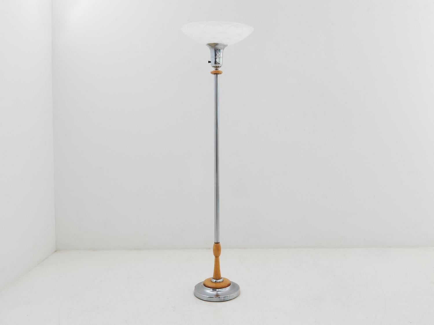 Hold onto your hats, folks, because this art deco torchiere lamp from the '40s is here to bring the sophistication and swankiness to your space. With its iconic design and timeless appeal, it's like having a piece of history right in your living