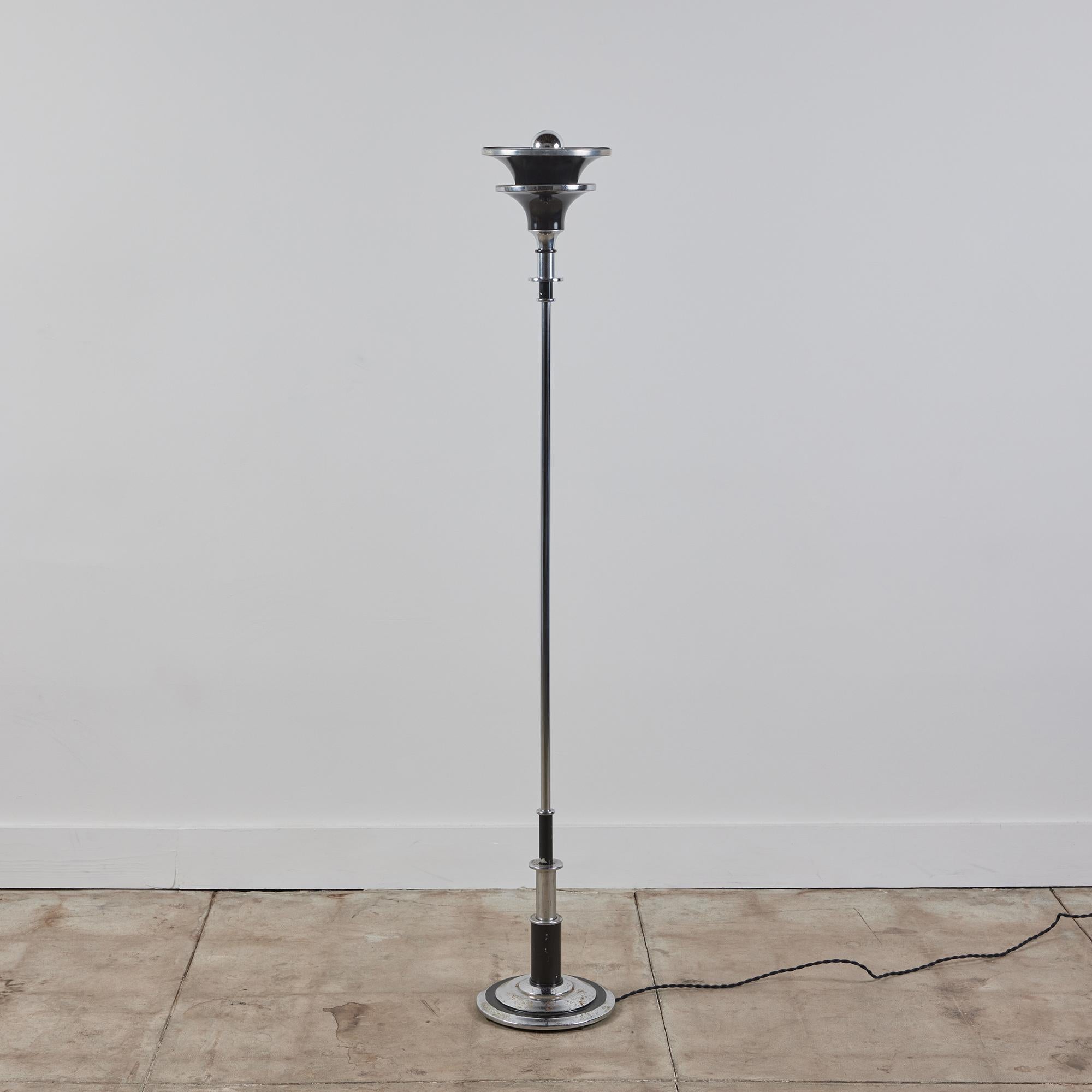 Art Deco mixed metal floor lamp. This lamp features a spun aluminum top shade and a chrome plated stem and base. The lamp has alternating chrome and black enameled details.

Dimensions
﻿10.25