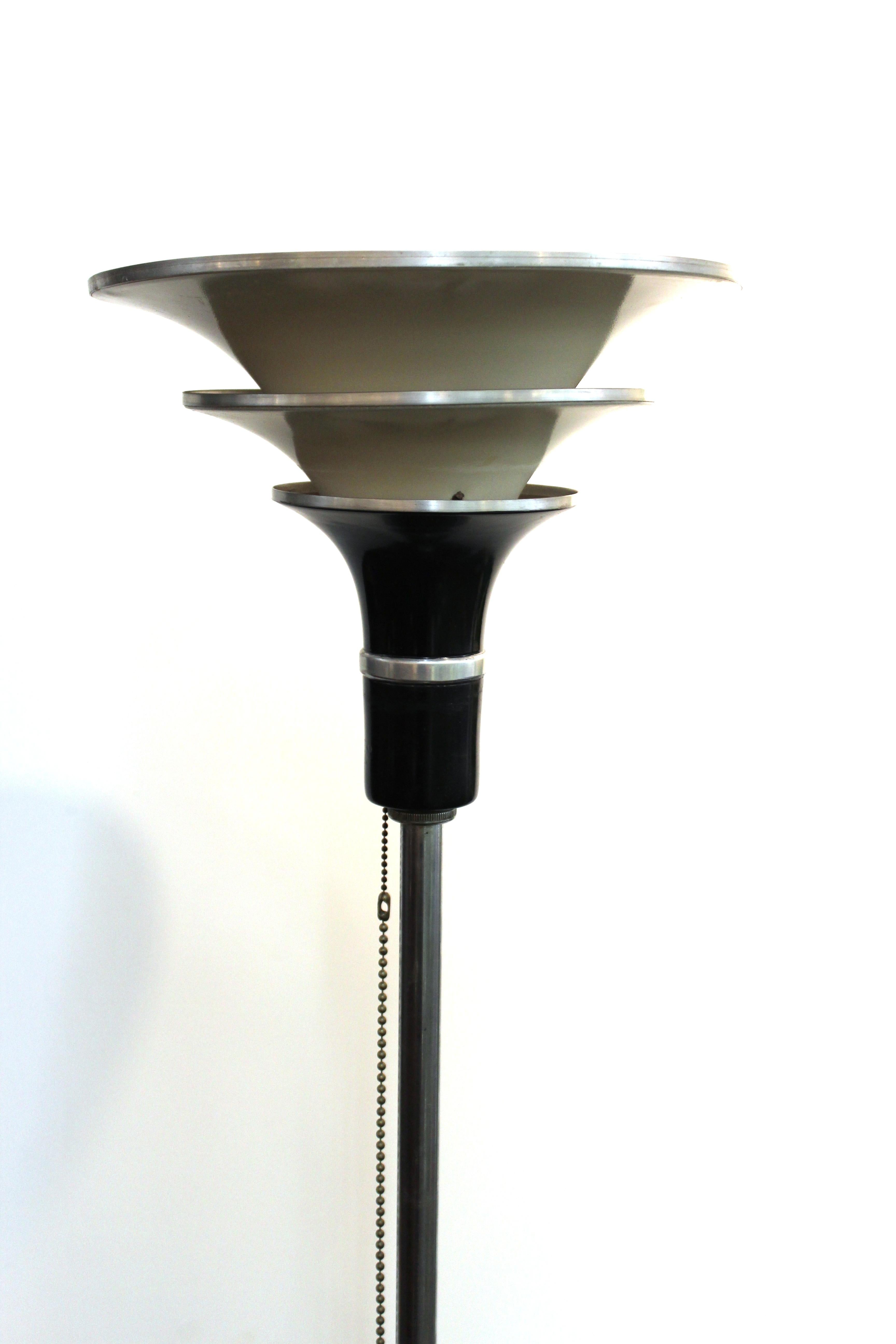 American Art Deco torchiere floor lamp with three-tiered metal shade in streamlined style. The piece was likely manufactured in the United States and is in great vintage condition with age-appropriate wear.