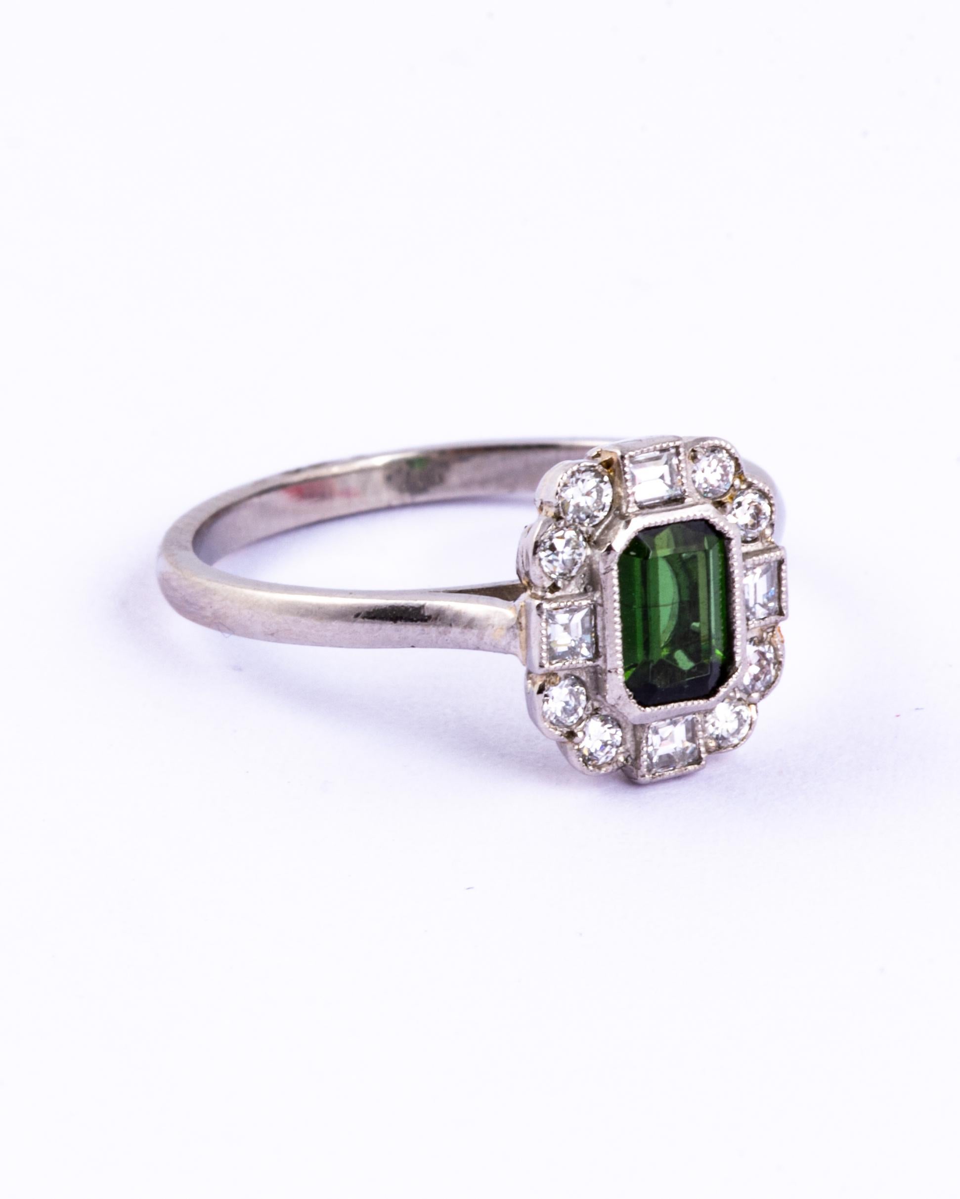 This gorgeous tourmaline is a deep green colour and measures approx 50pts. This stone is surrounded by square and round cut diamonds totalling approx 80pts. 

Size: O or 7 1/4 
Cluster Diameter: 11x9mm

Weight: 3.91g