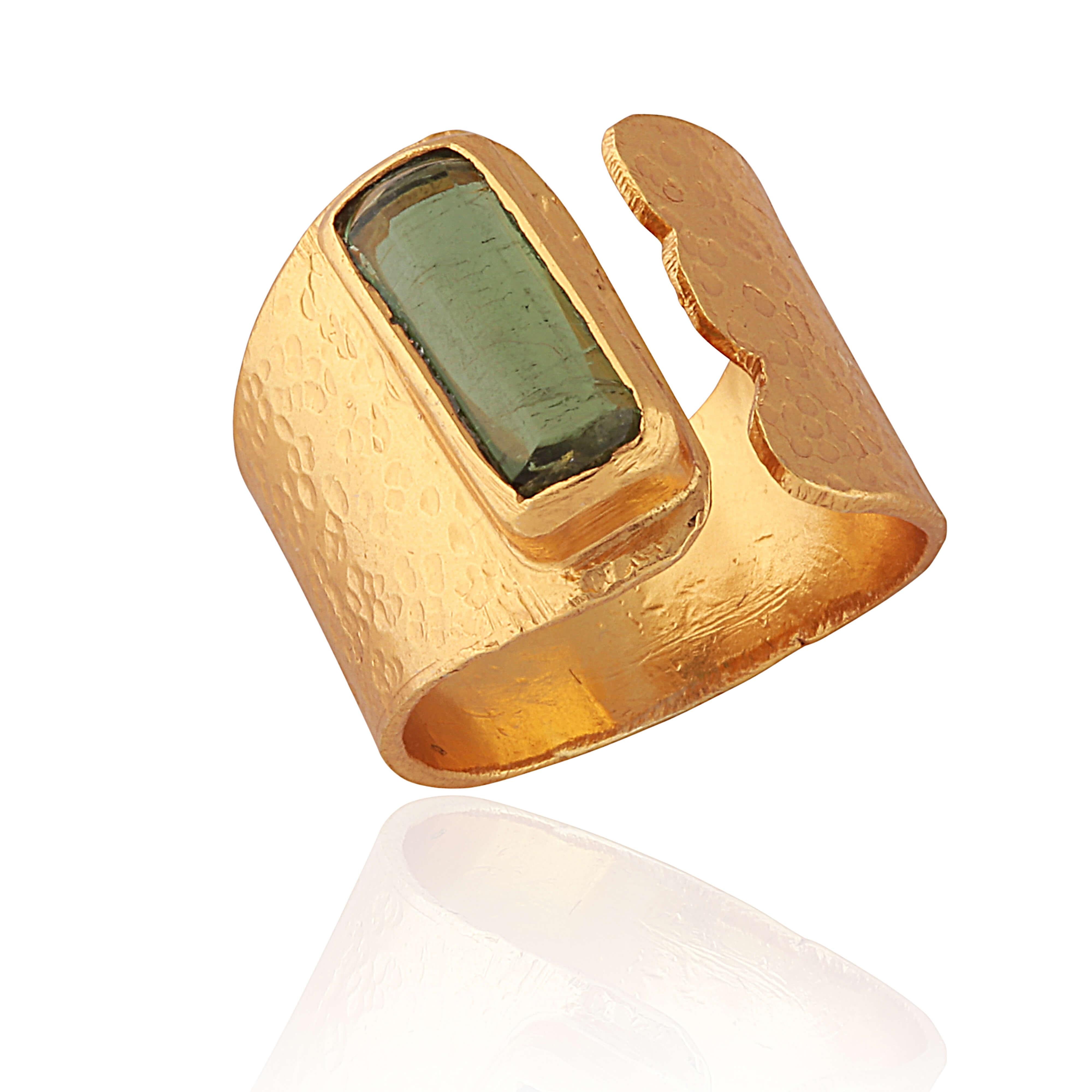 A beautiful art deco, on trend ring set with a striking tourmaline.

Has room for adjustment so the ring can fit various fingers.

Gold plated on silver.

UK Size P, 17.8mm