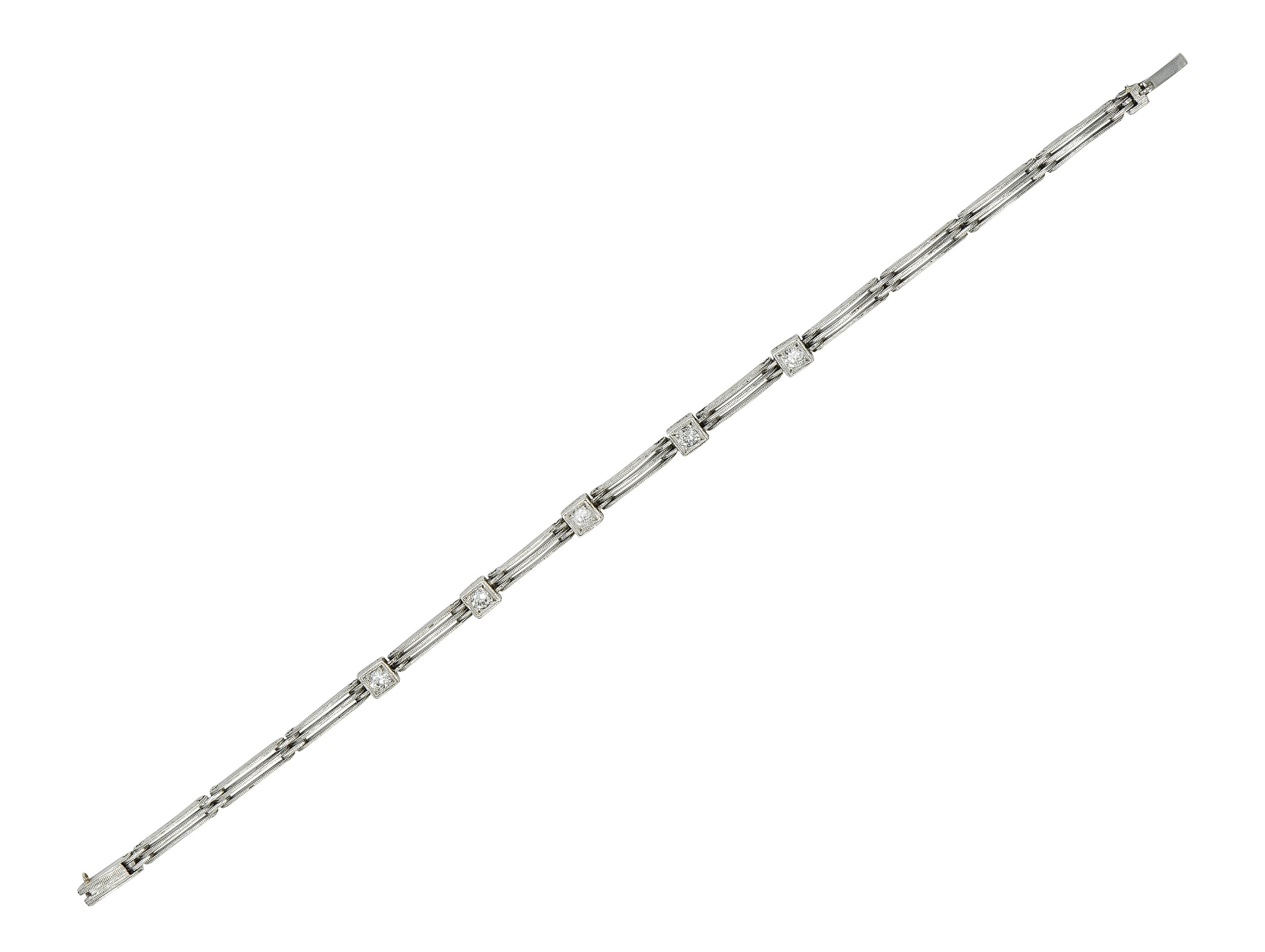 Comprised of hinged tri-split bar link with box link stations
Each centering a bead set transitional cut diamonds 
Weighing approximately 0.50 carat total - G/H color with VS2 clarity
Accented by wheat motif engraved profiles
Topped with milgrain