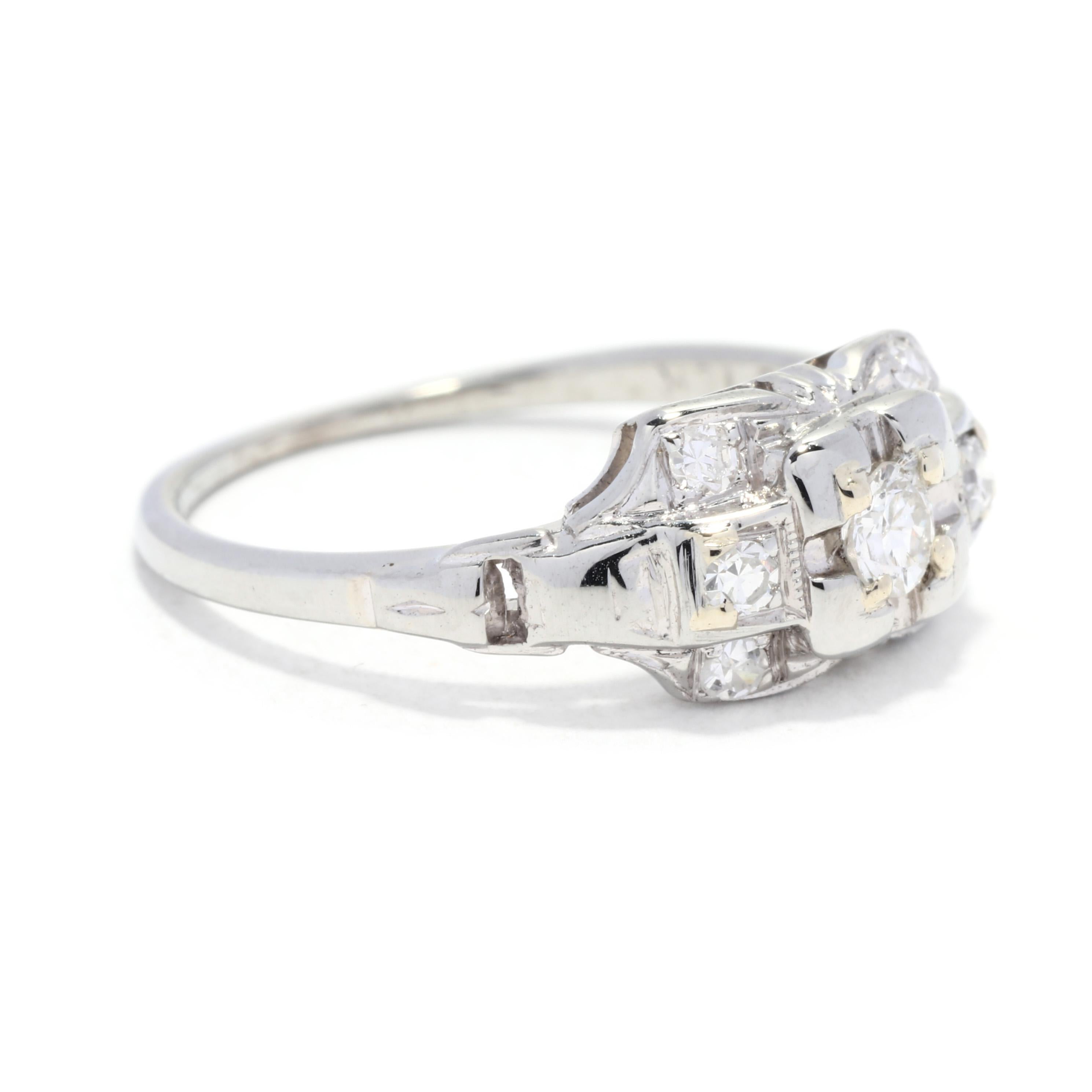 An Art Deco Traub old European cut diamond engagement ring. This antique orange blossom engagement ring features a horizontal rectangular design set with an old European cut diamond center stone weighing approximately .12 carat surrounded by single