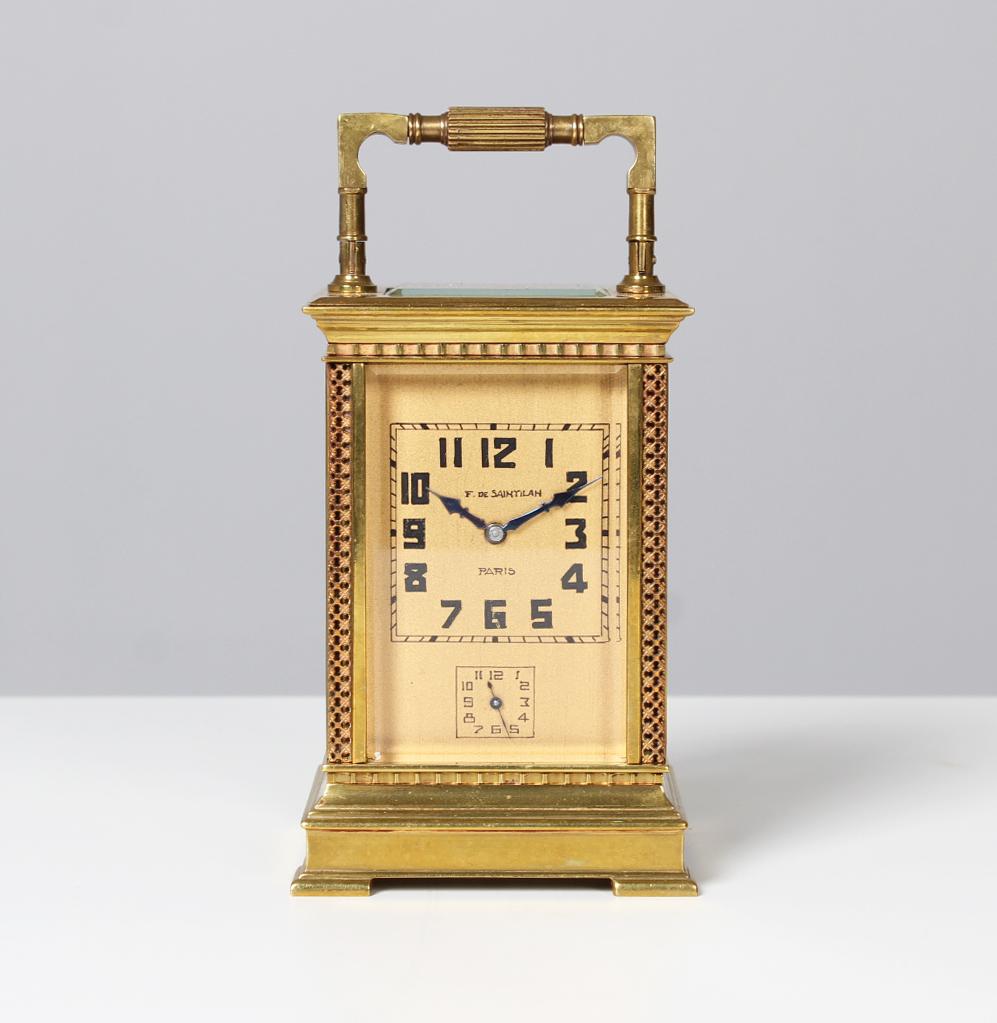 Art Deco travel clock with alarm

France
Brass
1920s

Dimensions: H x W x D: 13 x 8,5 x 7,5 cm

Description:
Beautiful small travel alarm clock in brass case with openwork stands.
Hand painted square dial on brass plate. Signed: F. De