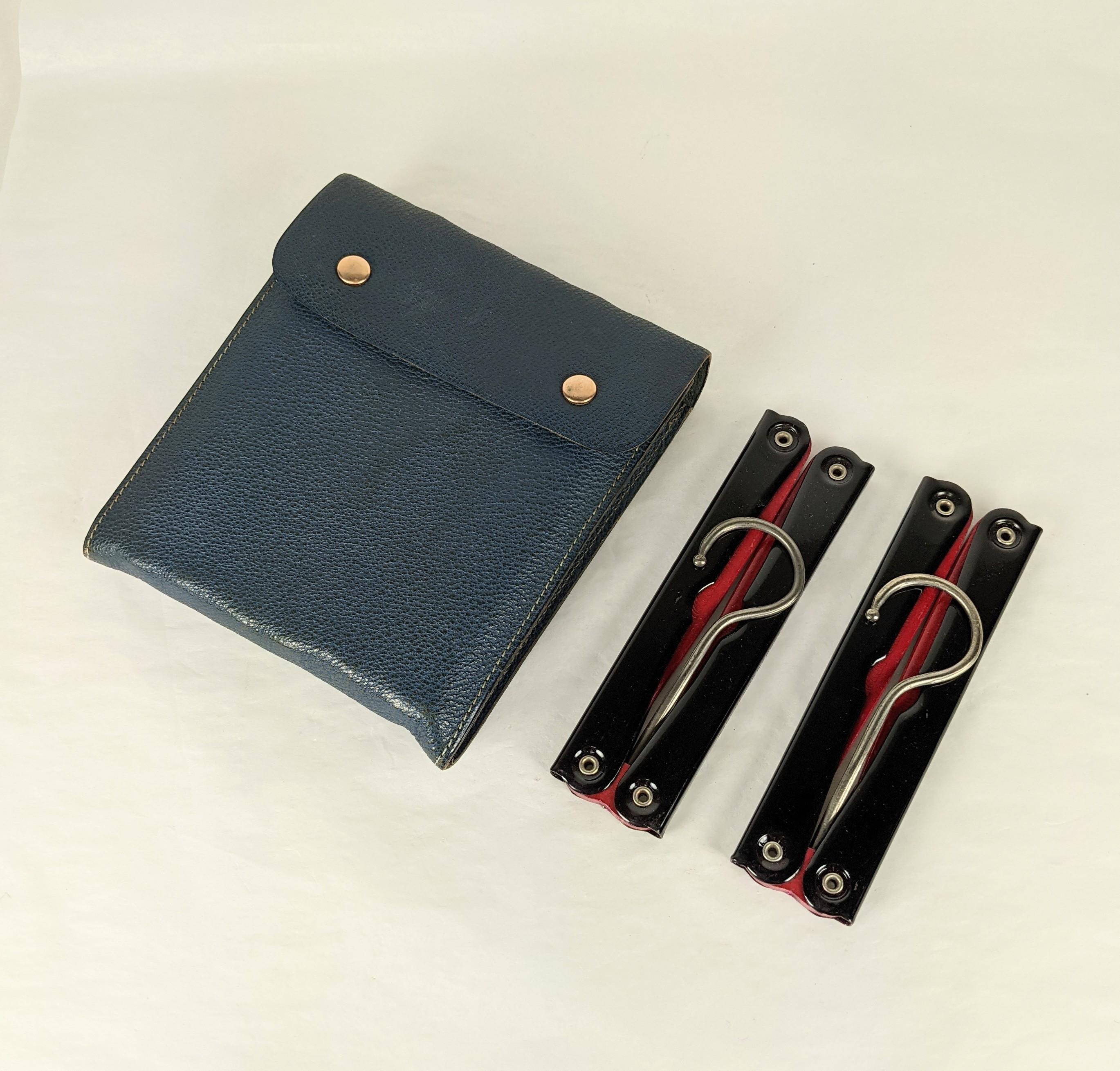Charming Art Deco Travel Hangers in blue leather case with 6 collapsible stained wood and metal hangers in the set.
 5