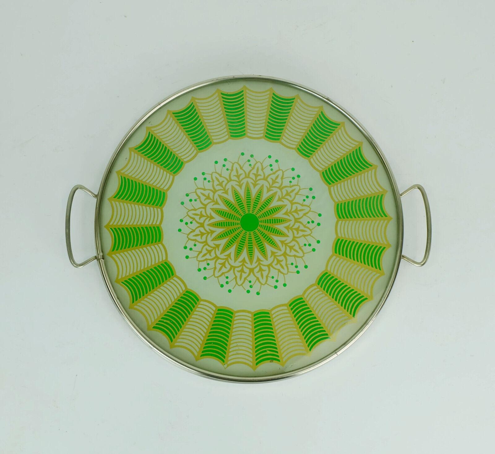 Beautiful old tray from the 1920s/30s. The base is made of glass and has an abstract reverse glass motif. The basic color of the decor is a very light pastel green, the motif itself is gold and green. The rim of the tray is made of chrome-plated