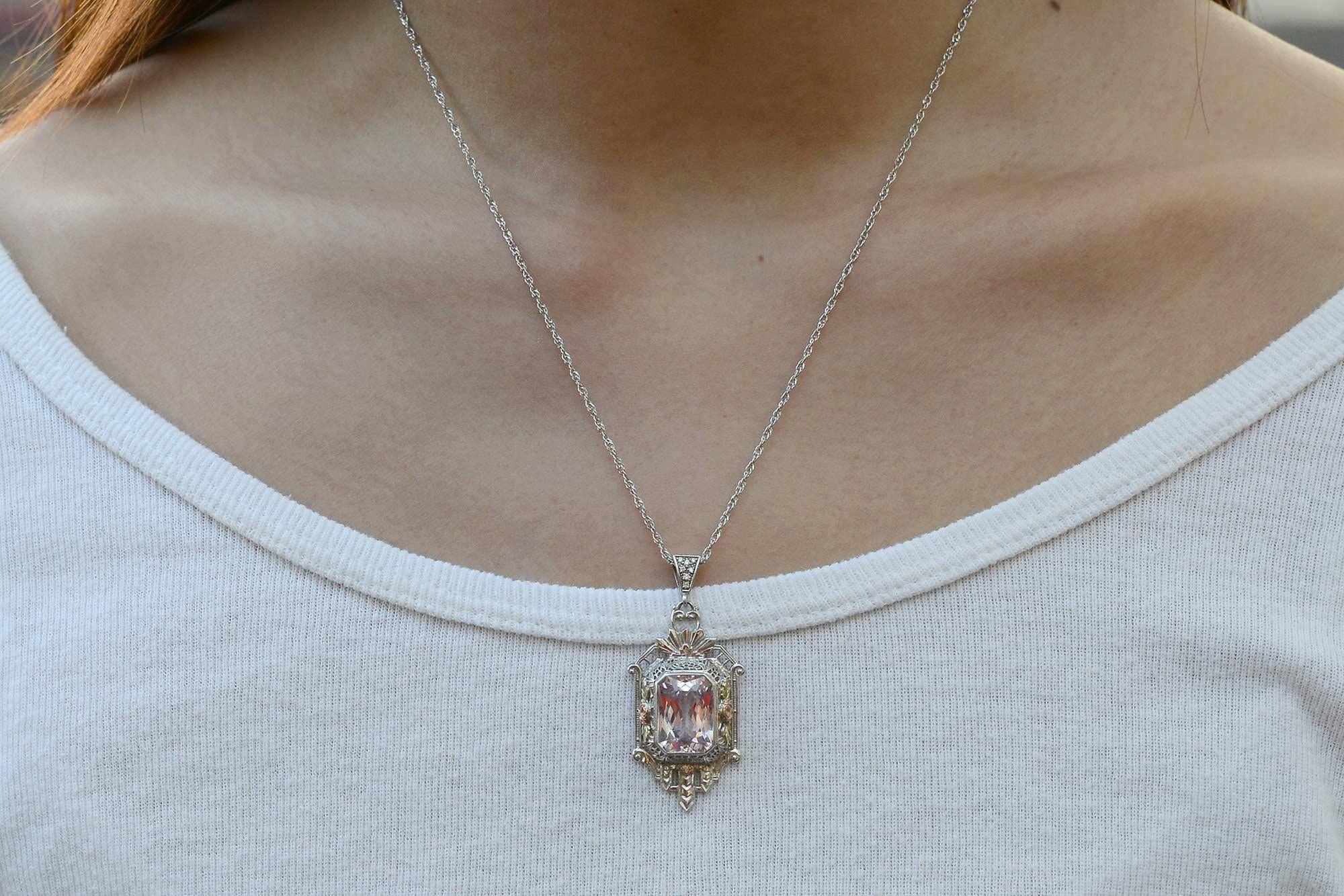 This original 1920s Art Deco pendant makes a distinctive and pronounced statement necklace. The blushingly bright 9 carat pink Kunzite features an outstanding octagonal mixed cut with geometric facets that catch light from every angle. The feminine