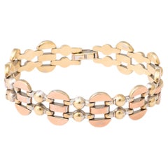 Art-Déco-Armband aus 14-karätigem Gold in drei Farben, mit Gelenken und stilisiertem kubistischem Design