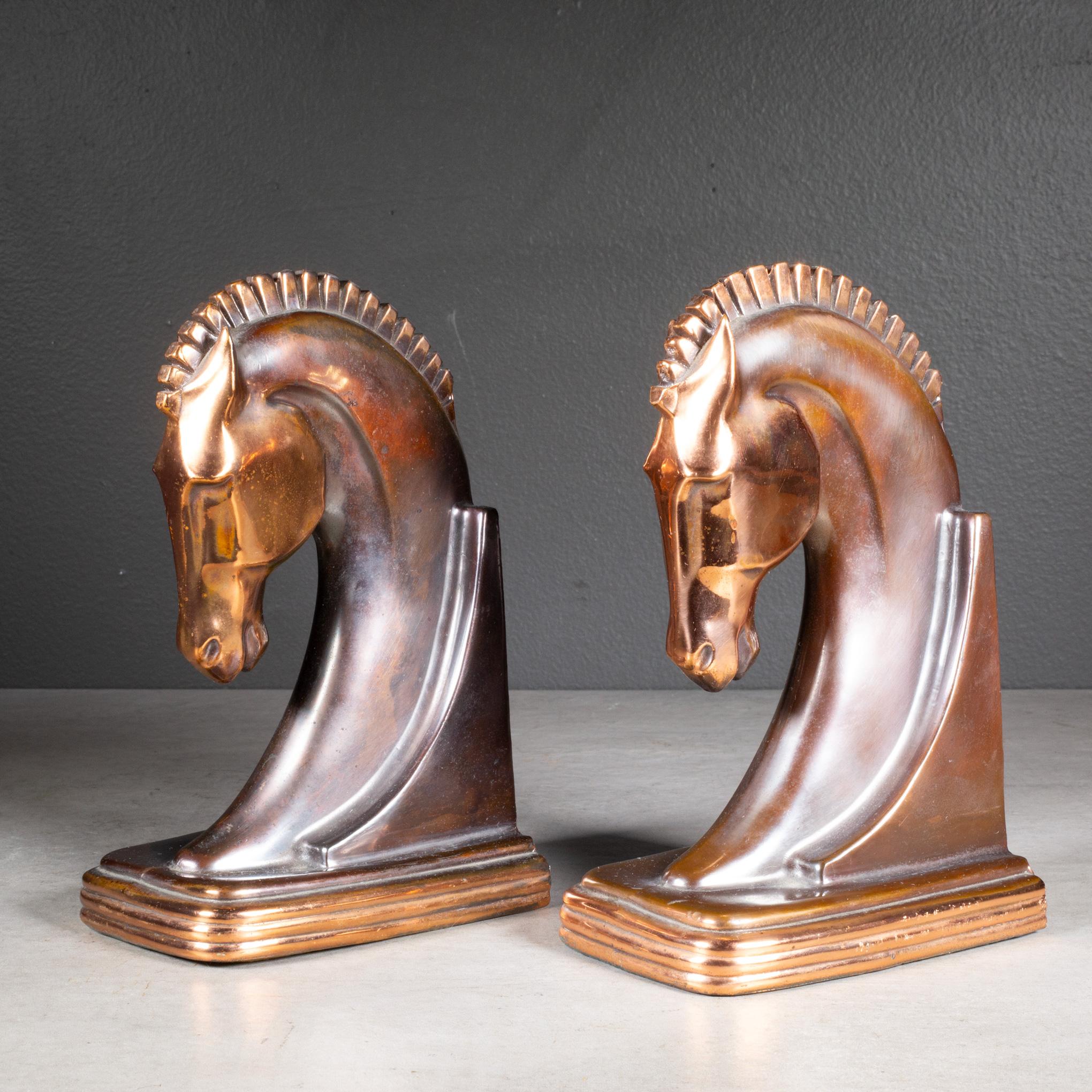 ABOUT

An original pair of Art Deco Trojan horse bookends manufactured by Dodge Trophy Company. Bronze plate body with copper on the base, face and mane. Both pieces have retained their original bronze and copper finish and are in good condition