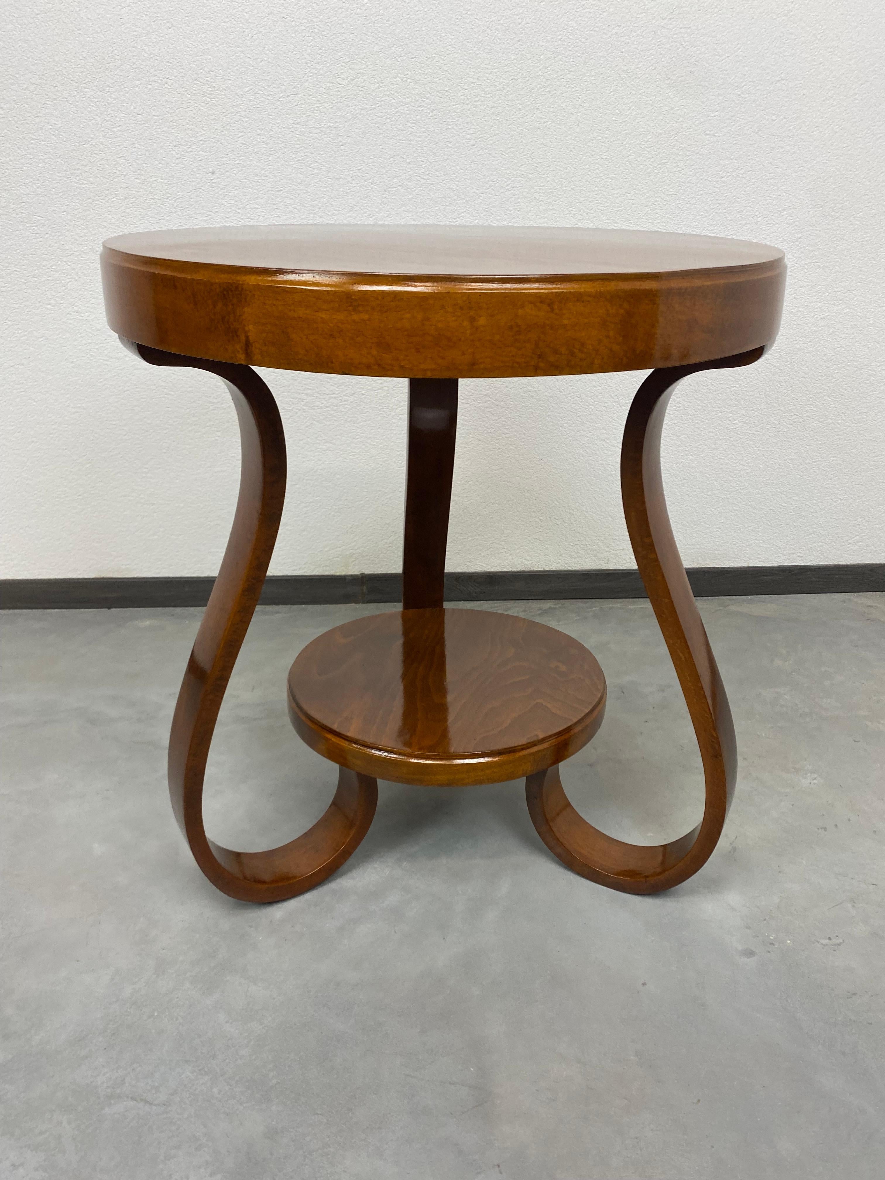 Art deco Tulip coffee table professionally stained and repolished.