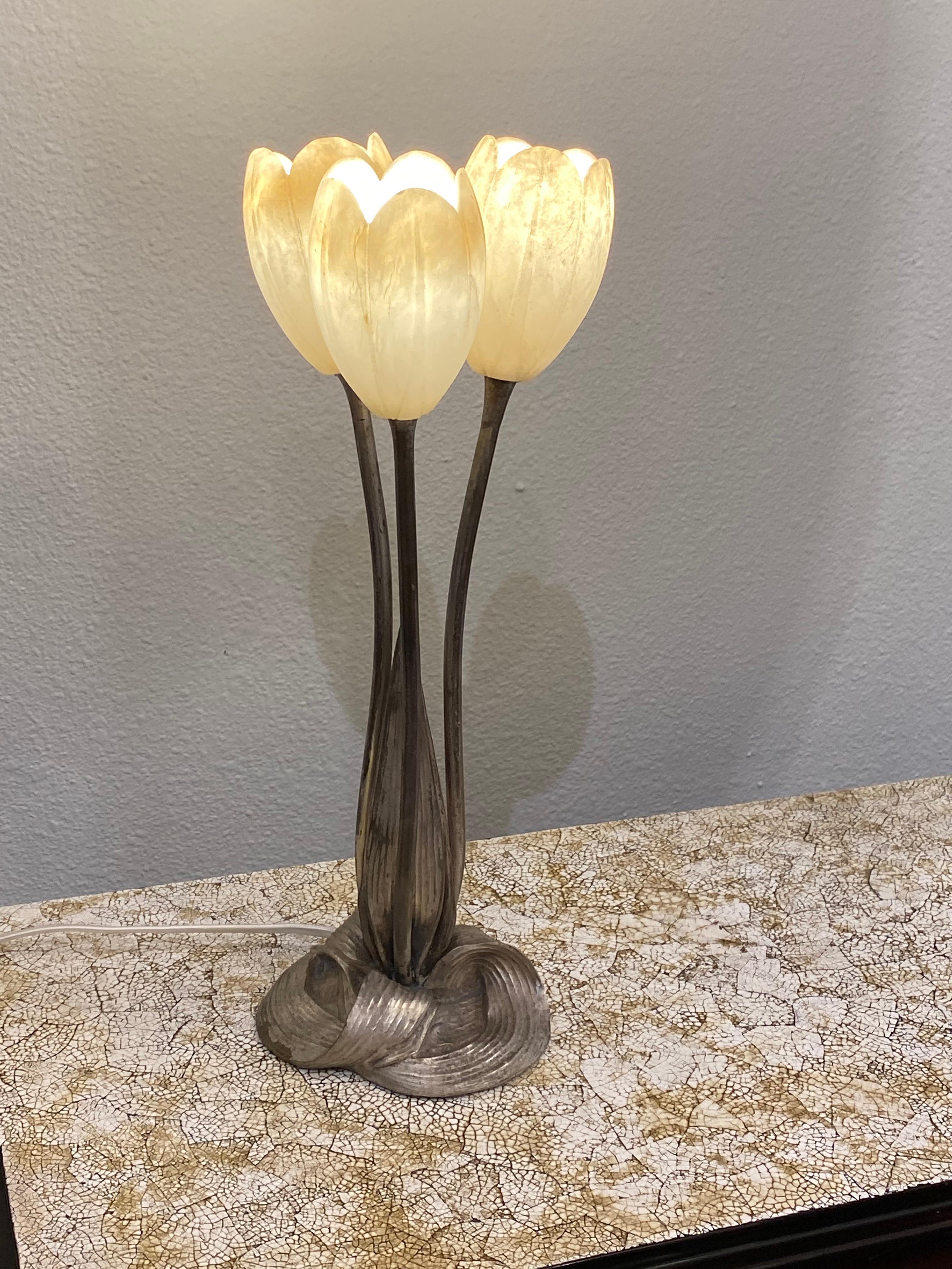 A rare and unique Art Deco table lamp by Albert Cheuret, depicting three tulips flowers made of cast silvered bronze and carved alabaster shades.
Made in France.
circa 1925
Signature: Albert Cheuret.

Albert Cheuret was born in 1884 in Paris.
