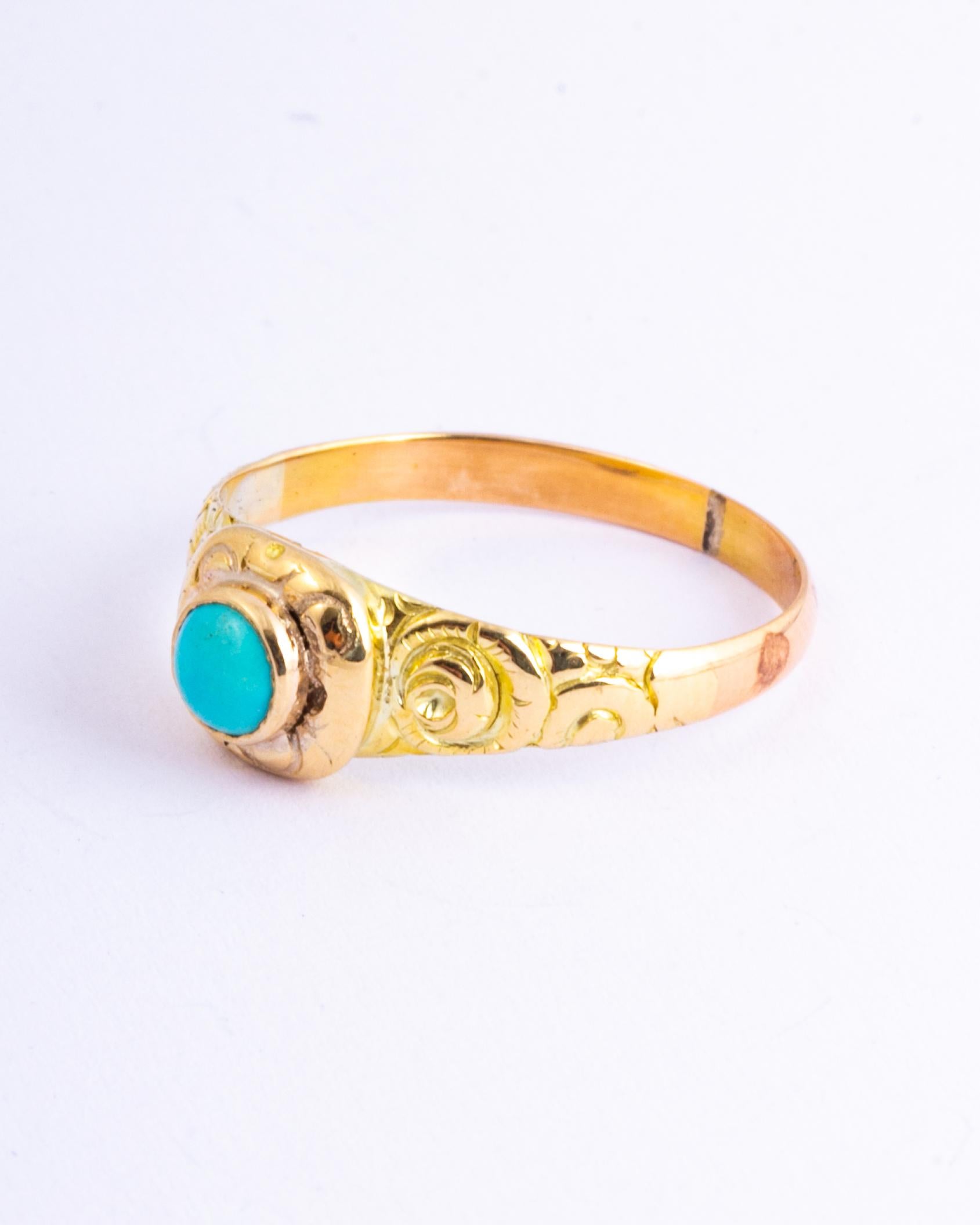 The central stone is set within an engraved setting and either side of this turquoise there are engraved shoulders. 

Ring Size: P or 7 1/2 
Widest Point: 7mm 
Height Off Finger: 5mm

Weight: 2.29g