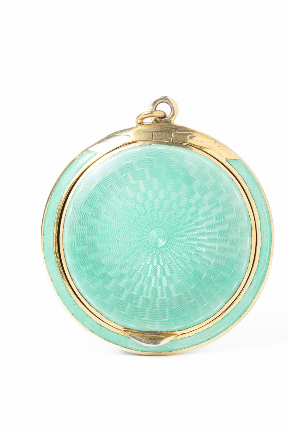 An extraordinary and rare Austrian Art Deco turquoise guilloche enamel and silver gilt mirror oval locket. This stunning piece is made in a striking and vibrant turquoise/mint guilloche enamel with a silver gilded interior and is dated 1924. The