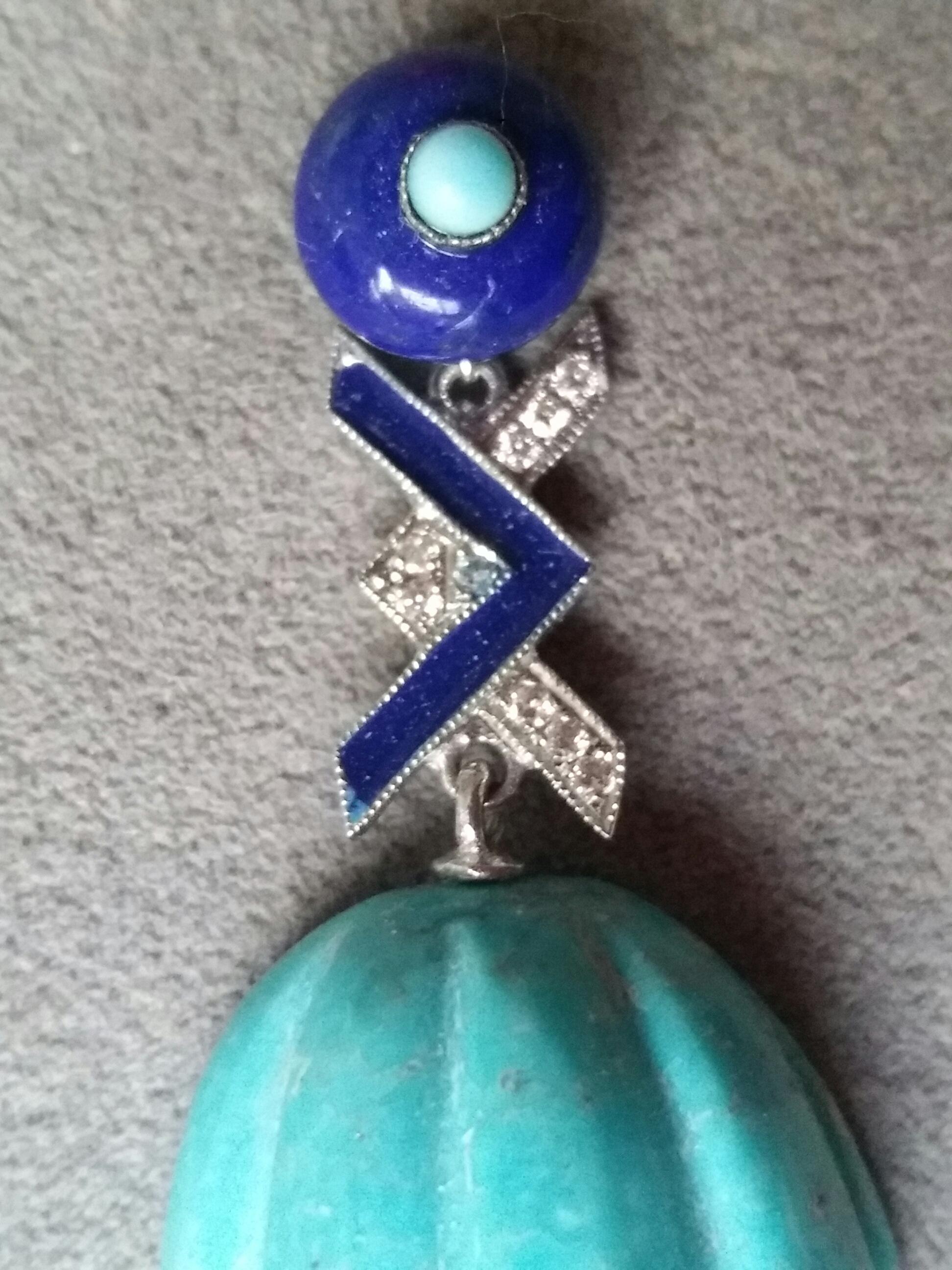 Tops are 2 round Lapis Lazuli of 8 mm in diameter with a small turquoise round cab in the center,middle parts are in white gold,diamonds and blue enamel,bottom parts are 2 Genuine Turquoise carved drops
Length 43 mm
Width  19 mm
Weight 13 grams
In