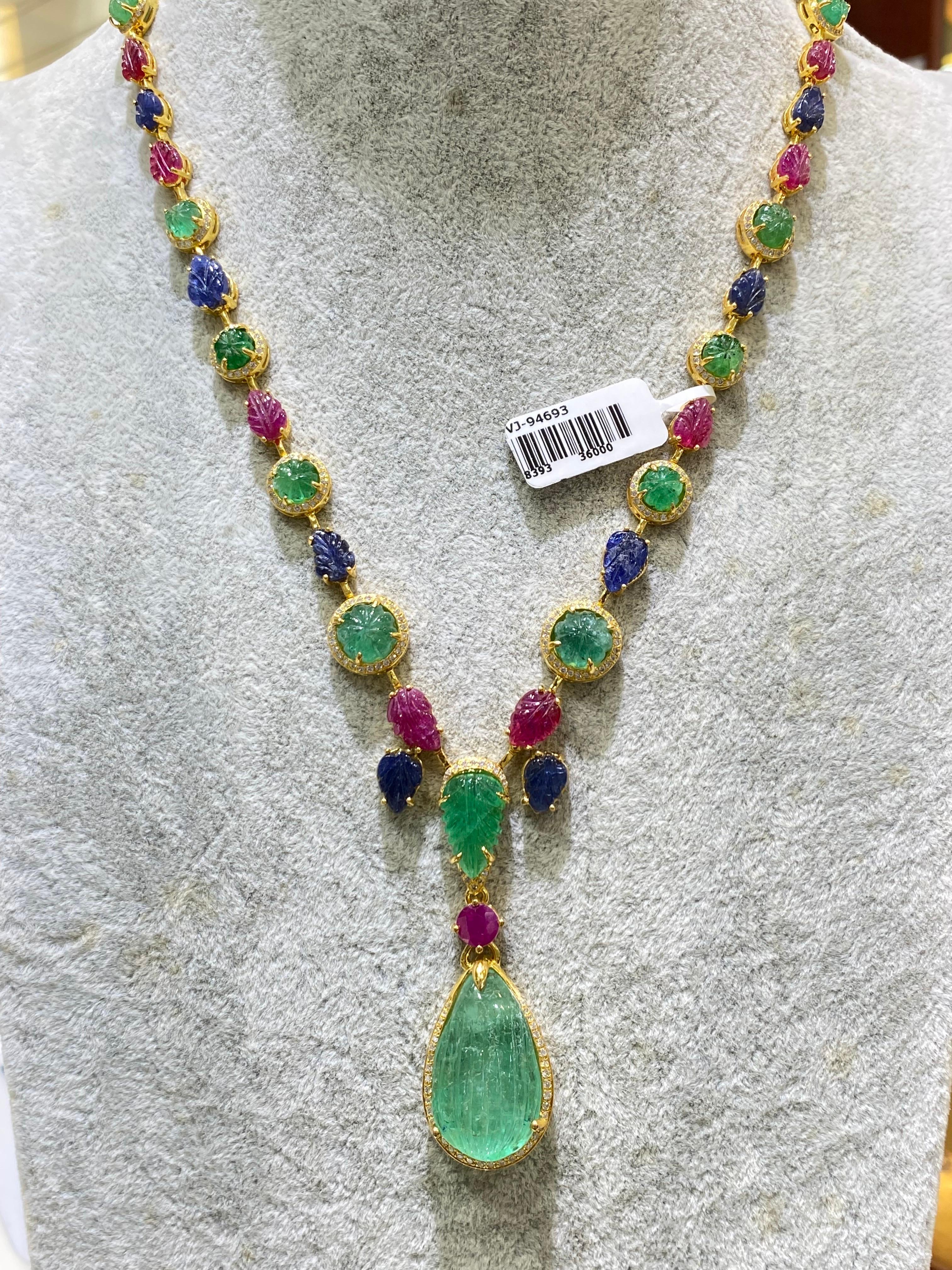 A beautiful tutti-frutti art-deco necklace with vibrant colored natural gemstones, 56.3 carats Colombian Emerald, 24.84 carat Ruby, 15.64 carat Sapphire and 1.65 carat Diamonds - all set in solid 18K Yellow Gold. The necklace is around 20 inches