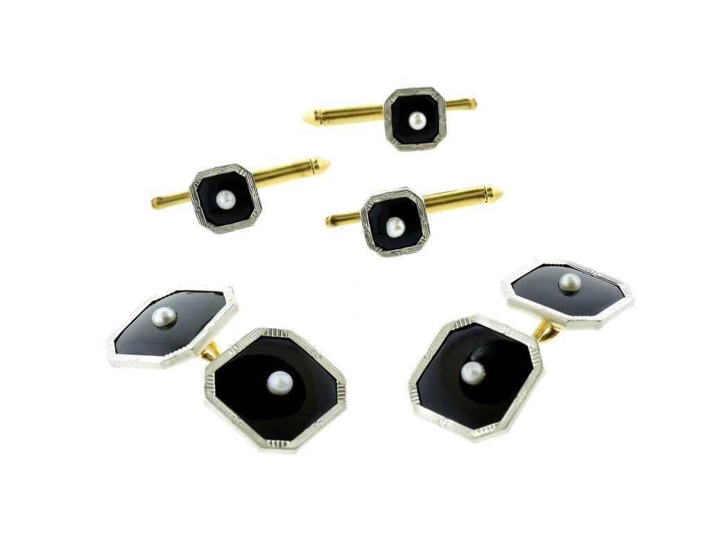 Art Deco cuff and stud Tuxedo Set, c. 1935. Crafted in 14k yellow and platinum which has been engraved with a geometric pattern, this cuff and stud set feature black onyx and round white pearl accents. The octagonal design highlights the contrast
