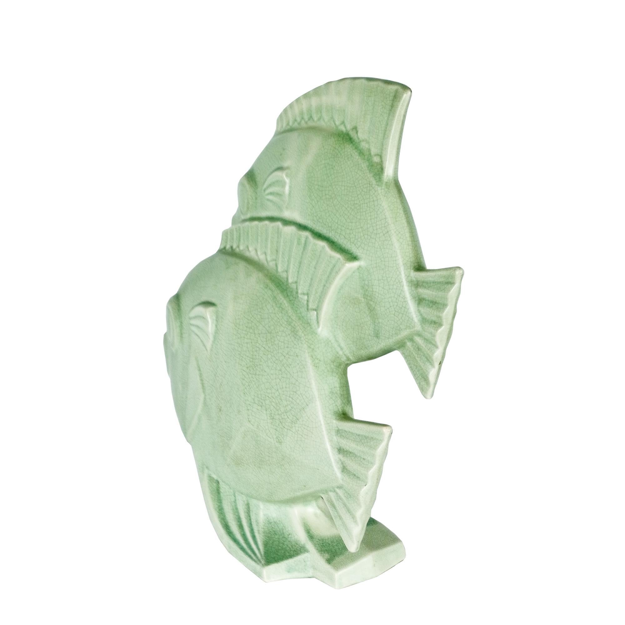 Due pesci in stile Art Déco, in ceramica screpolata verde celadon.

Modello di 