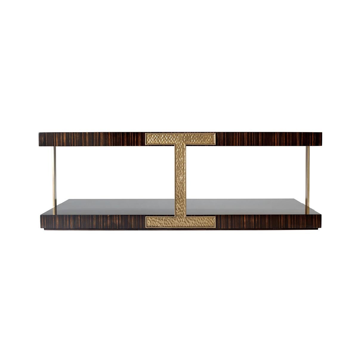A modern rectangular coffee table crafted with simulated ebony veneer with an Amara finish and hammered brass finish metal accents. 

Dimensions: 52