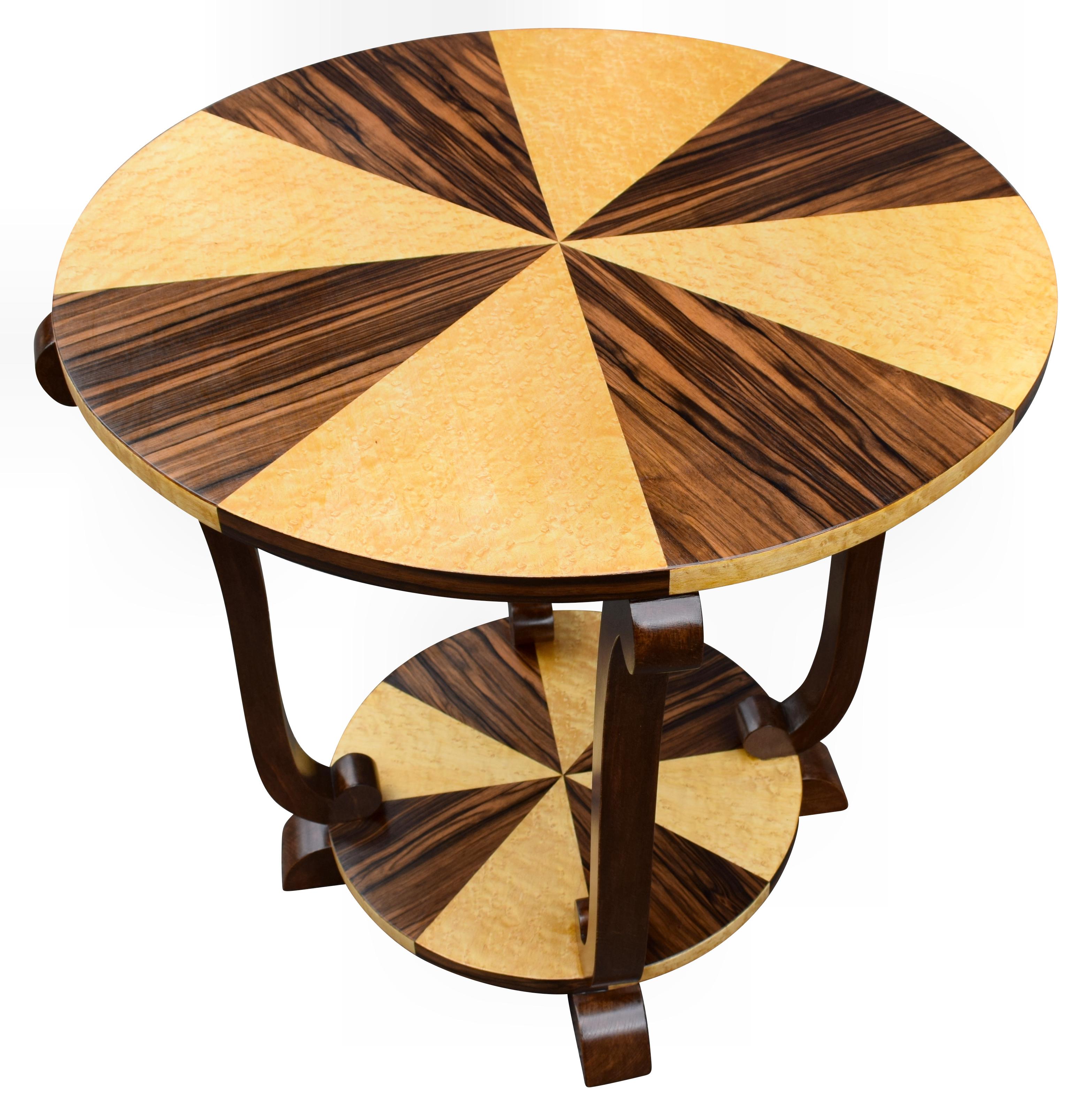 Very stylish and totally authentic French Art Deco walnut and maple centre table dating to the 1930s. This table is beautifully shaped and fully restored to showroom condition. Typically larger than occasional coffee tables, these make ideal pieces
