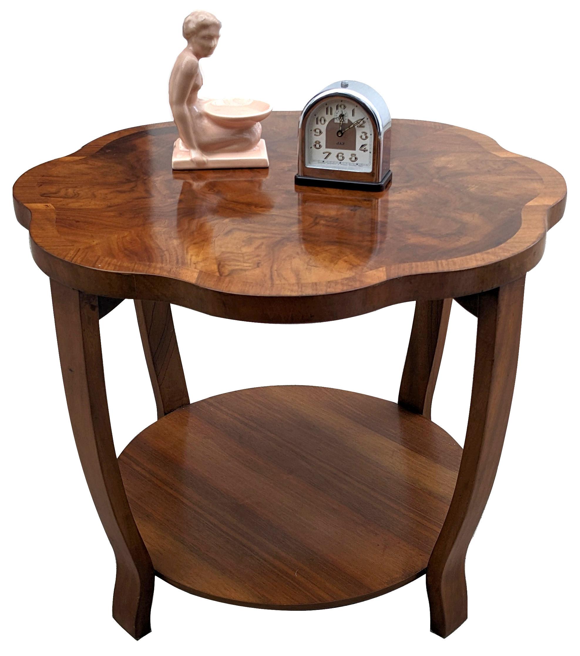 This is a stunning looking table with superb Deco design and shape. Ideal size for modern day use and a easily integrated for most rooms. Light tone book paged figured walnut veneers, with feather band edging, beautifully shows off the scalloped