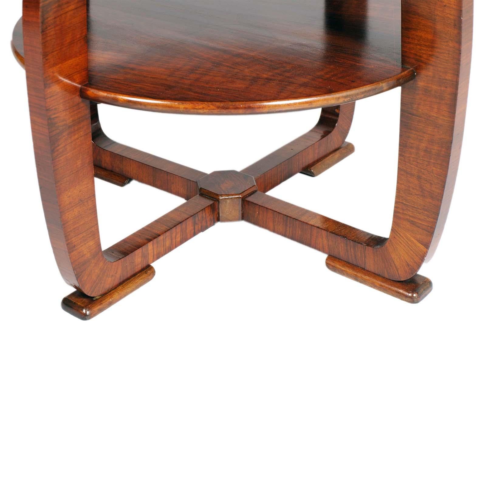 Art Deco two tier central coffee table by Gio Ponti & Emilo Lancia designers for Meroni & Fossati manufacturer in figured massive walnut , circa 1930s.
The designs obtained from the walnut wood are created by the combination of solid wood, which